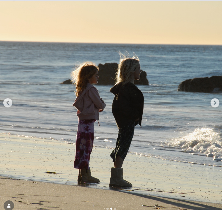 Standing side by side at the water's edge, siblings Kaia and Presley Gerber gaze out at the ocean waves together during a golden-hour beach outing revisited in a June 25, 2025 post. | Source: Instagram/presleygerber
