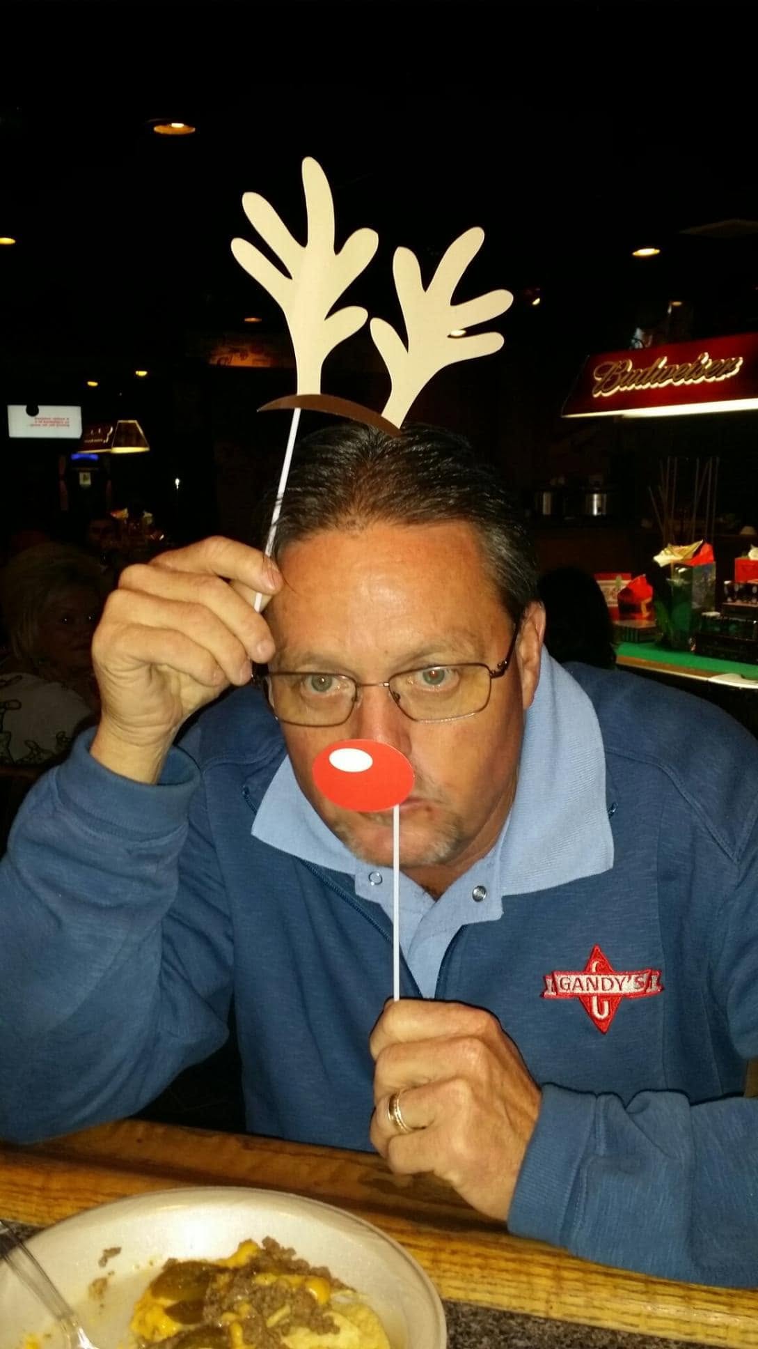 Ed Scott was remembered for his lighthearted spirit and deep ties to community athletics. On this occasion, he posed at a restaurant for a photo shared during an anniversary celebration on January 14, 2025. | Source: Facebook/Laura Vasquez Scott