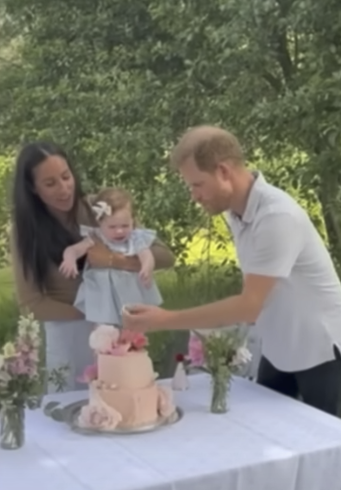 Meghan Markle, Princess Lilibet and Prince Harry during a birthday celebration | Source: YouTube/LMT