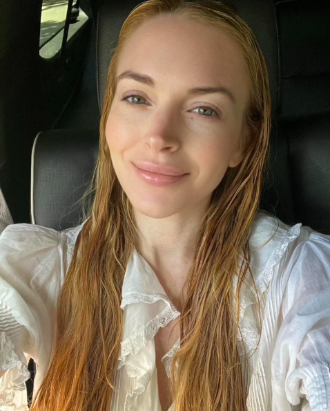 Lindsay Lohan smiling for the camera, posted on May 29, 2025. | Source: Instagram/lindsaylohan