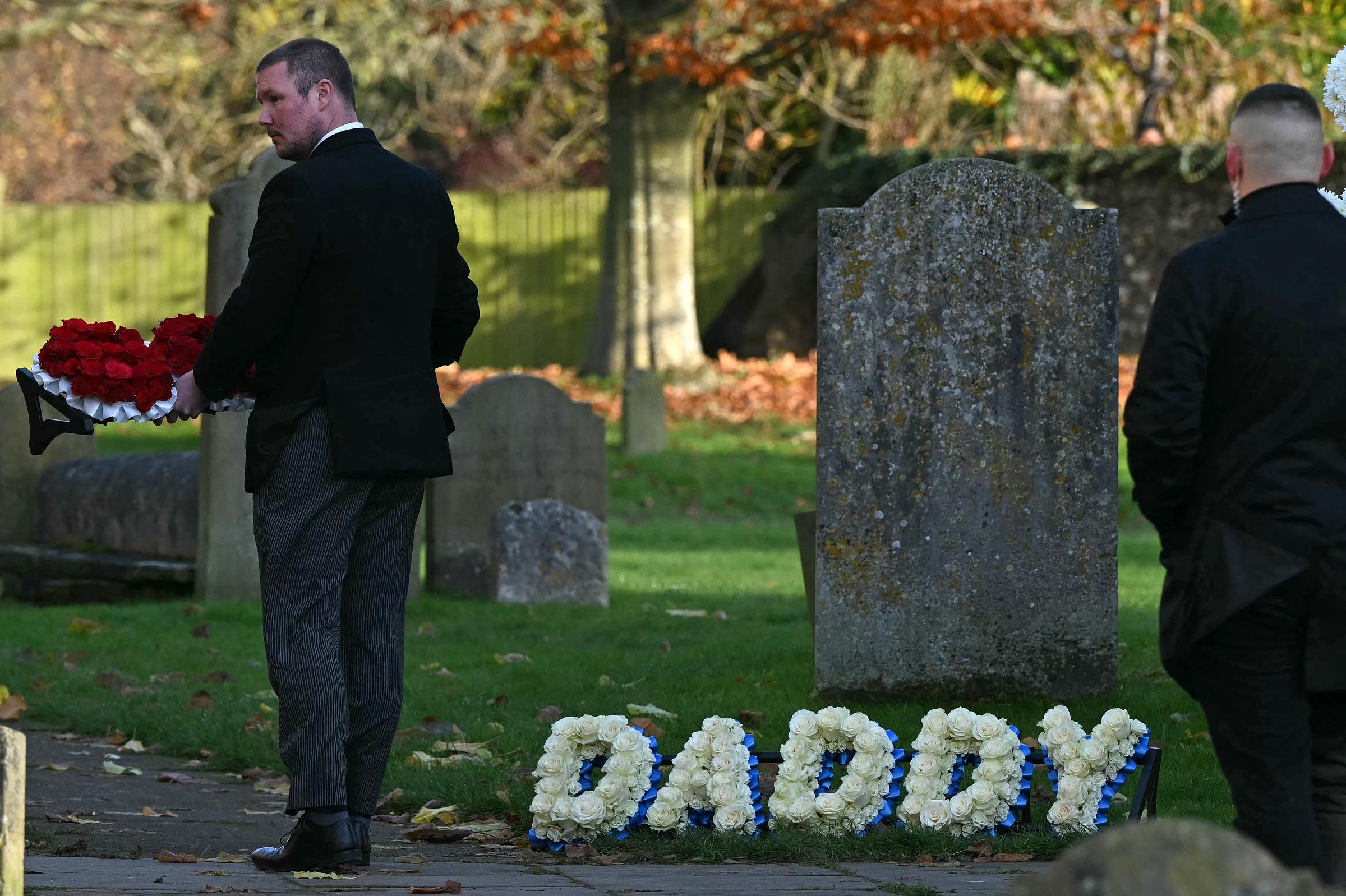 Flowers are carried into the church ahead of the funeral service of the late One Direction singer Liam Payne, on November 20, 2024 | Source: Getty Images