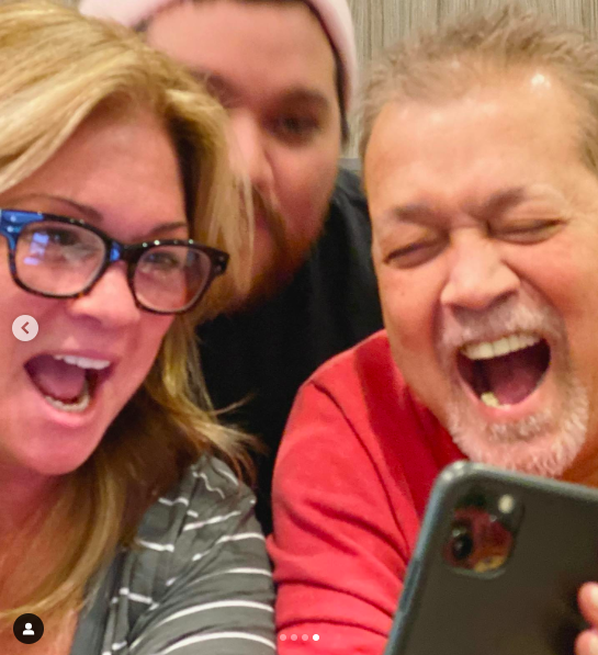 Valerie Bertinelli, Wolfgang and Eddie Van Halen looking at something on a phone, posted on October 25, 2019 | Source: Instagram/wolfvanhalen
