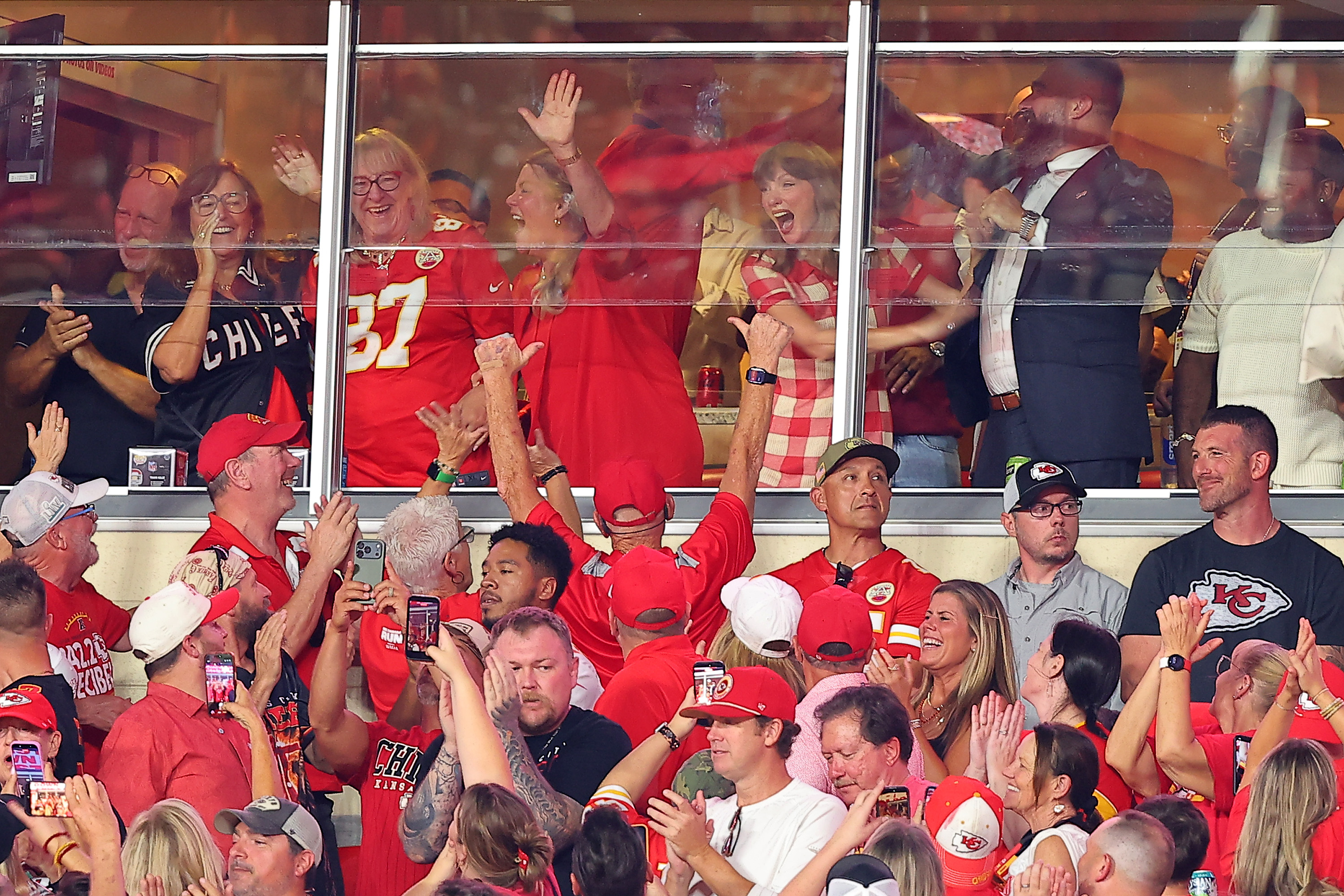 Donna Kelce, Taylor Swift, and Jason Kelce cheer from the suite following Travis Kelce’s 59-yard third-quarter reception as the Kansas City Chiefs take on the Denver Broncos at Arrowhead Stadium on September 14, 2026. | Source: Getty Images