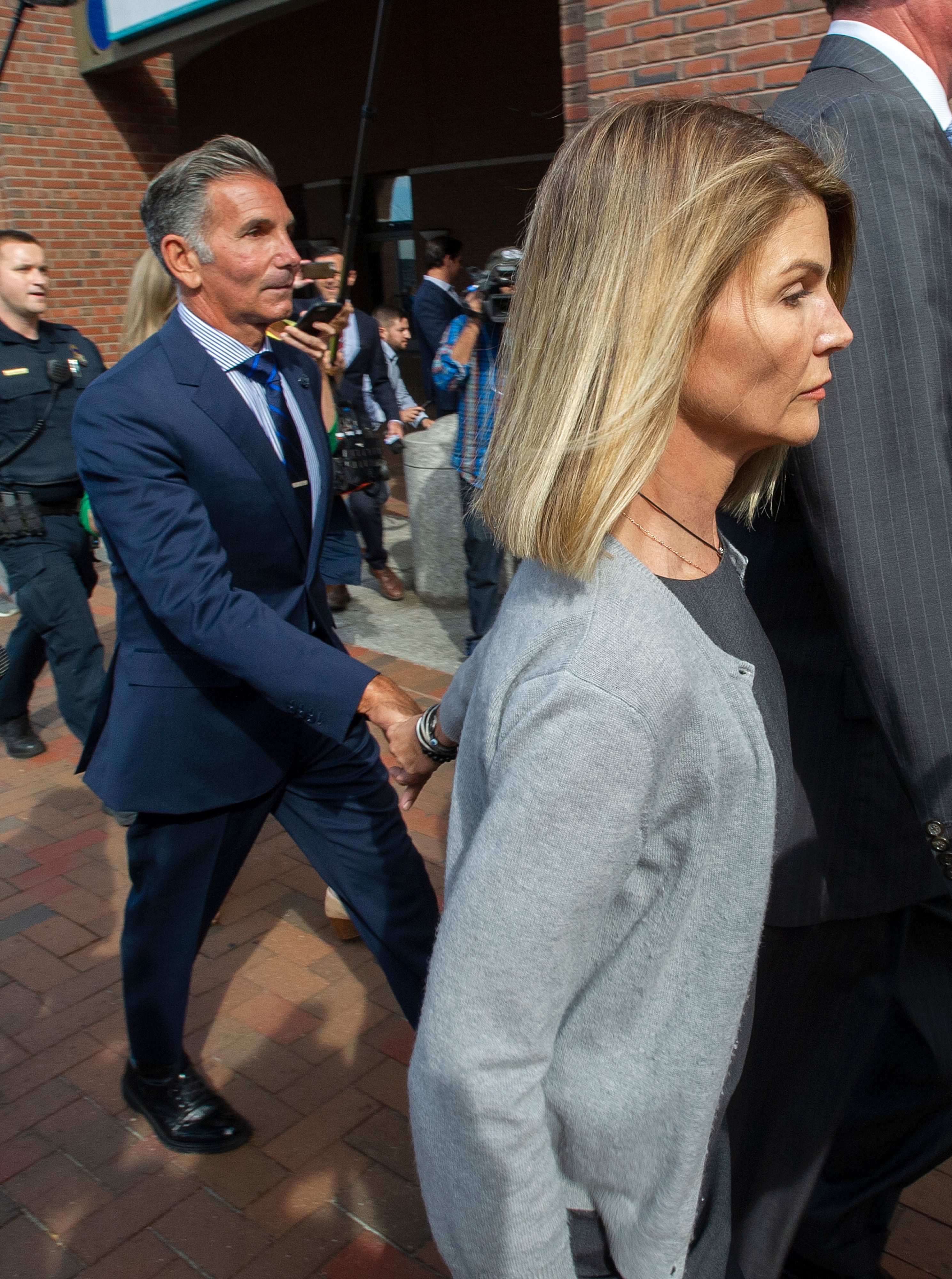 Loughlin and Giannulli leave federal court in Boston on August 27, 2019, during an earlier chapter of their marriage. Six years later, they would separate after nearly three decades together, with Loughlin eventually filing for divorce in September 2026. | Source: Getty Images