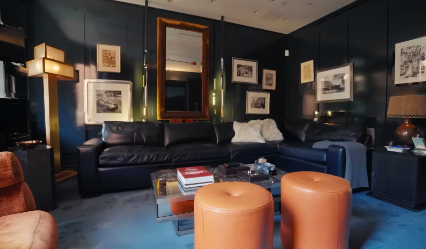 The media room is one of the boldest spaces in the townhouse. It is moody, glossy, and clearly not designed to please everyone. | Source: YouTube/Architectural Digest