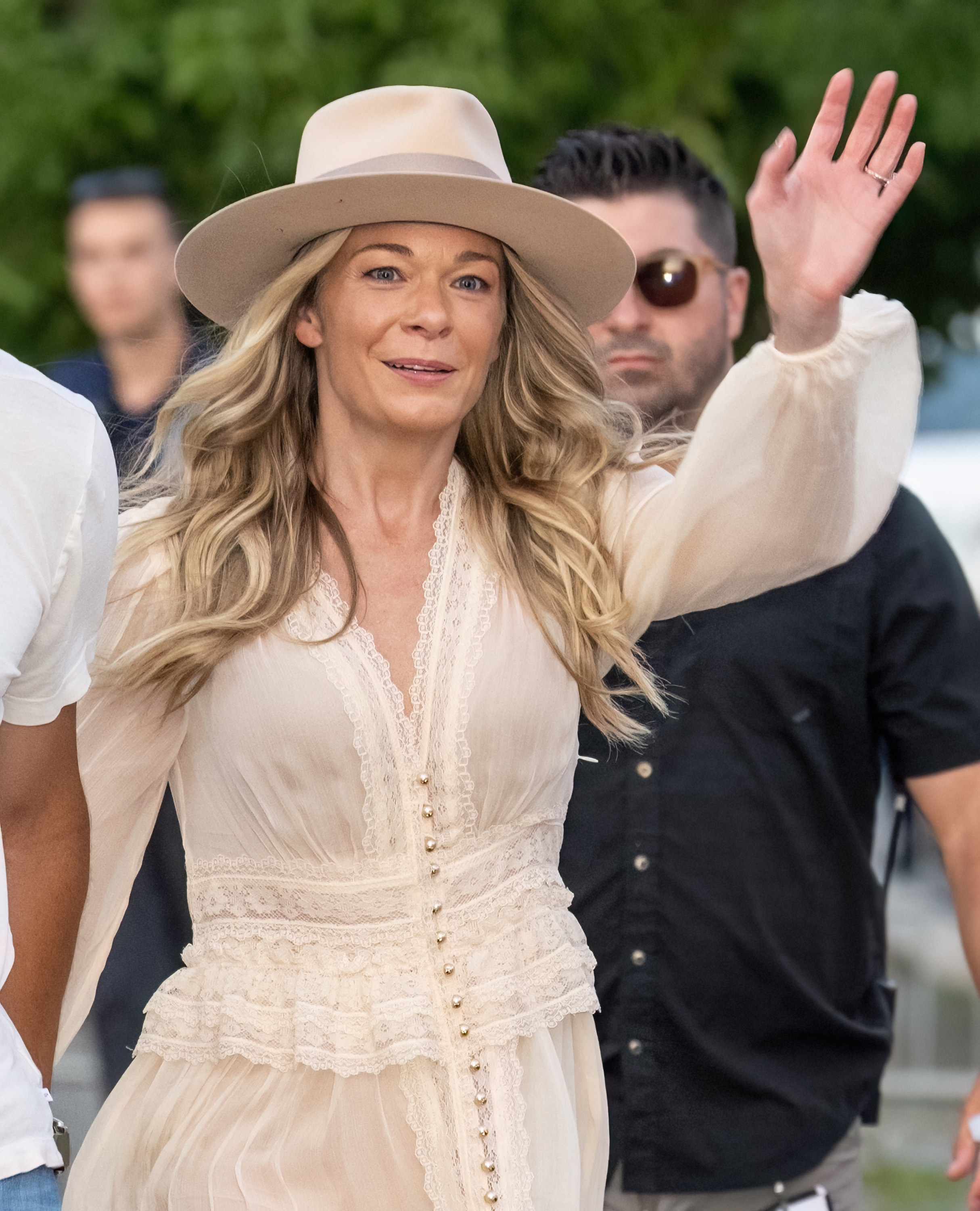 Leann Rimes seen waving as she leaves the Salute to Service event featuring the United States Army Field Band in Philadelphia, Pennsylvania on July 3, 2024 | Source: Getty Images