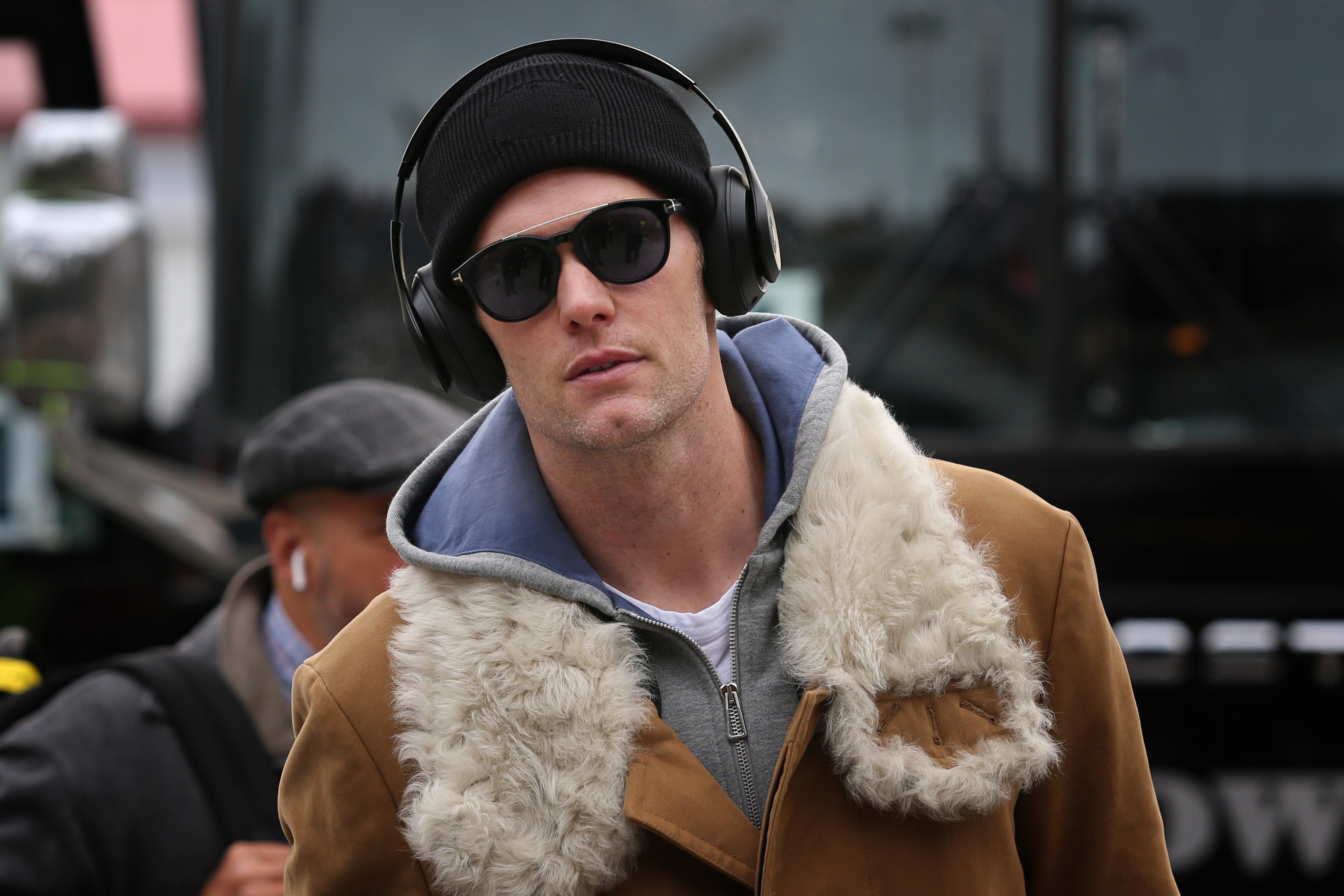 Sporting dark shades and headphones that perfectly matched his laid-back vibe, Tom Brady exuded gracefulness as he walked into Arrowhead Stadium ahead of the AFC Championship Game between the New England Patriots and Kansas City Chiefs.