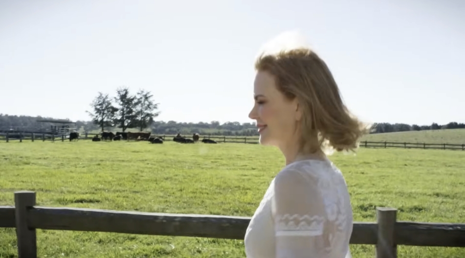 Lush green pastures dotted with cattle unfold beside Nicole Kidman, highlighting the property's role as a working farm as much as a peaceful retreat. From a video dated July 20, 2015. | Source: YouTube/Vogue