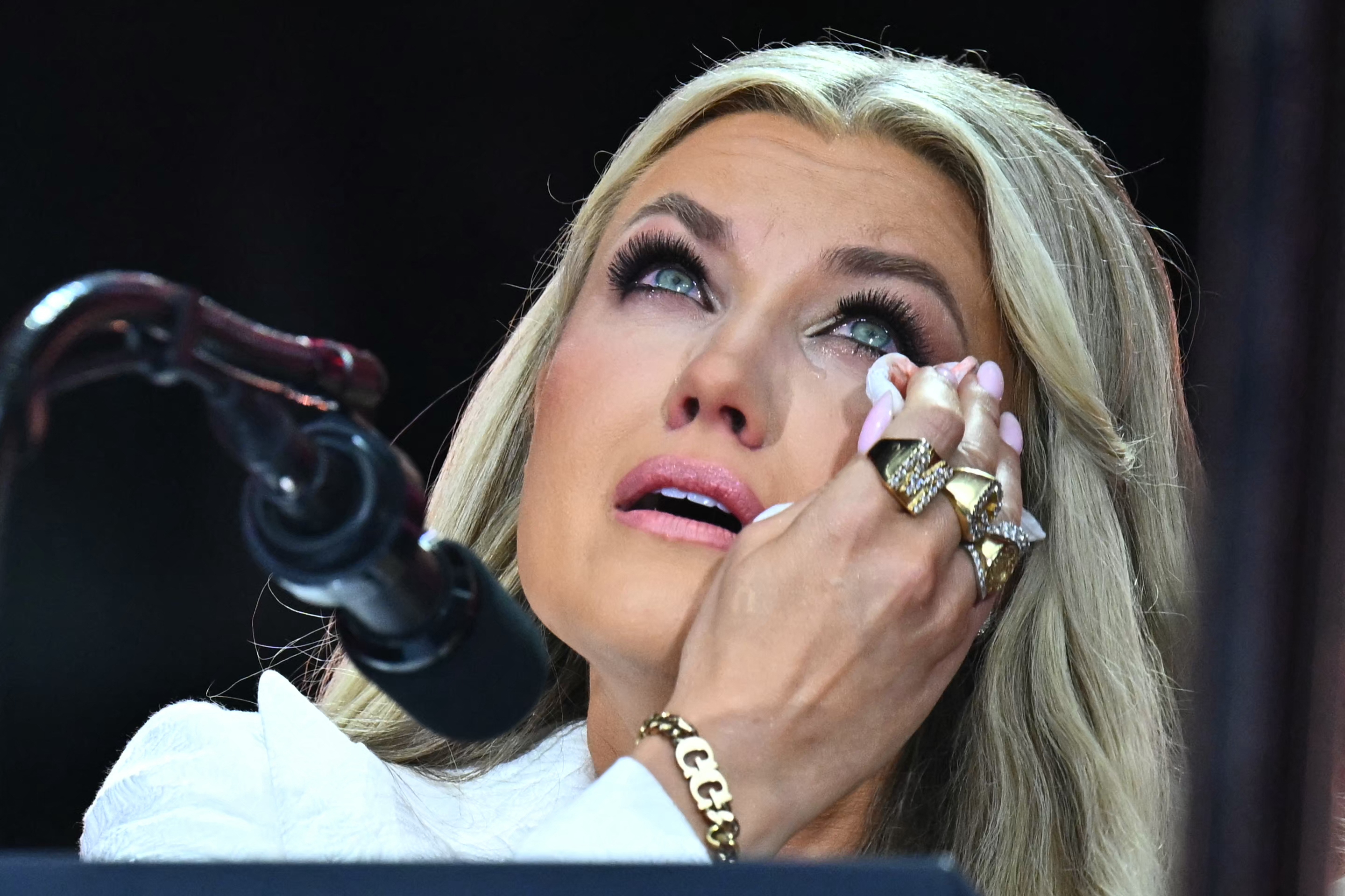 Erika Kirk wiping away tears at her late husband's memorial service. | Source: Getty Images