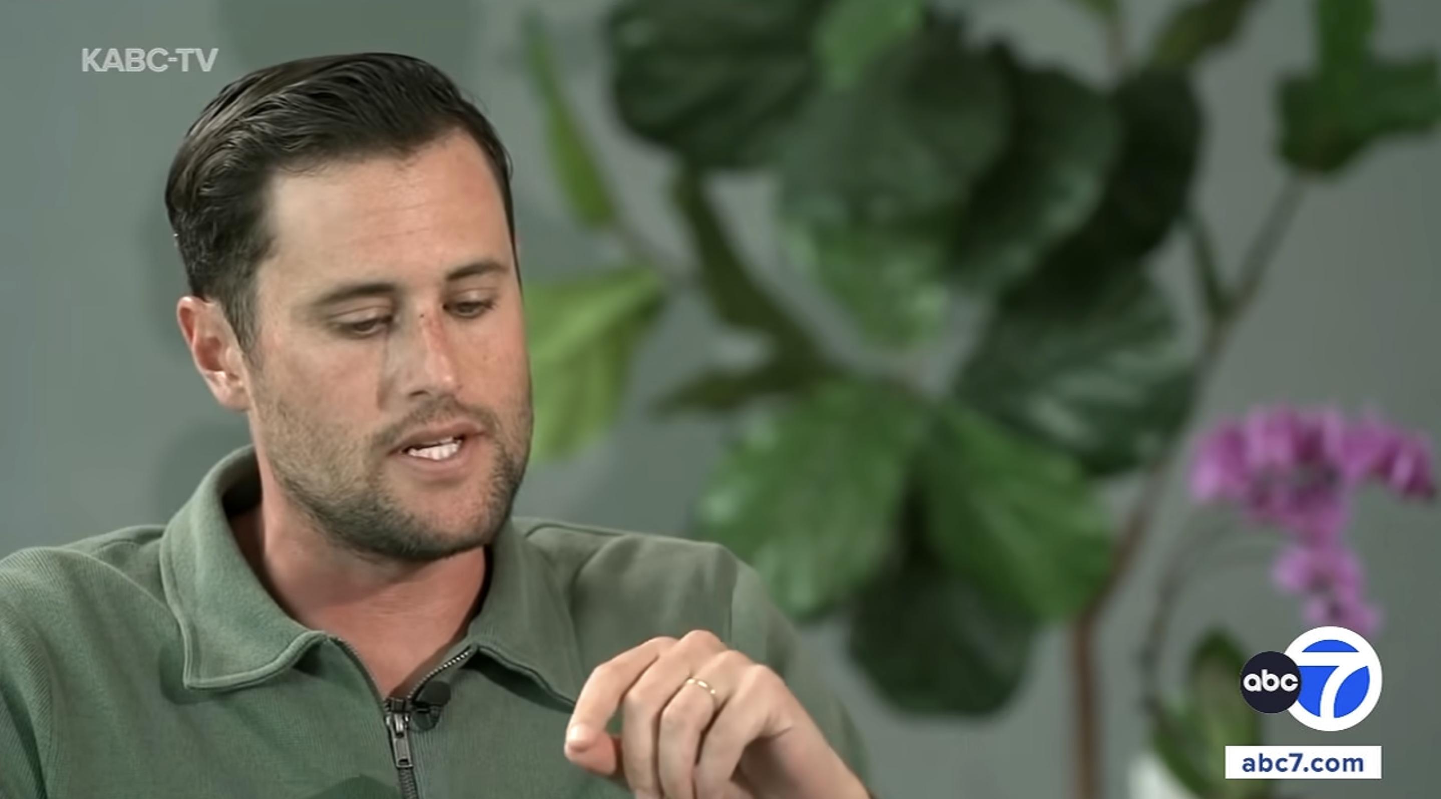 Jake's left hand came into clear view as he gestured during his ABC7 interview, revealing a slim gold-colored band on his ring finger. The image was captured around the time he reportedly married Maria Gilfillan. | Source: YouTube/ABC7