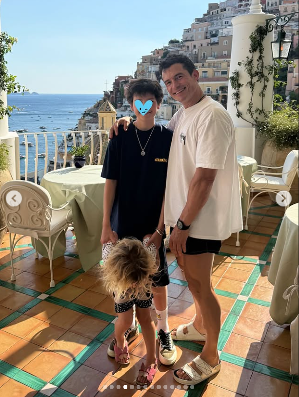Orlando Bloom and his children Flynn and Daisy in a seaside courtyard, from an Instagram post dated July 9, 2025. | Source: Instagram/orlandobloom
