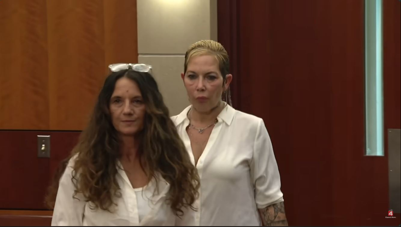 Kim Scott entered the courtroom in a loose white button-down shirt, with her short blonde hair slicked back and tattoos visible along her forearm. The rare public appearance, captured in a video dated August 13, 2026, came as Eminem's ex-wife faced ongoing legal proceedings following OWI charges and alleged bond violations. | Source: YouTube/Click On Detroit | Local 4 | WDIV