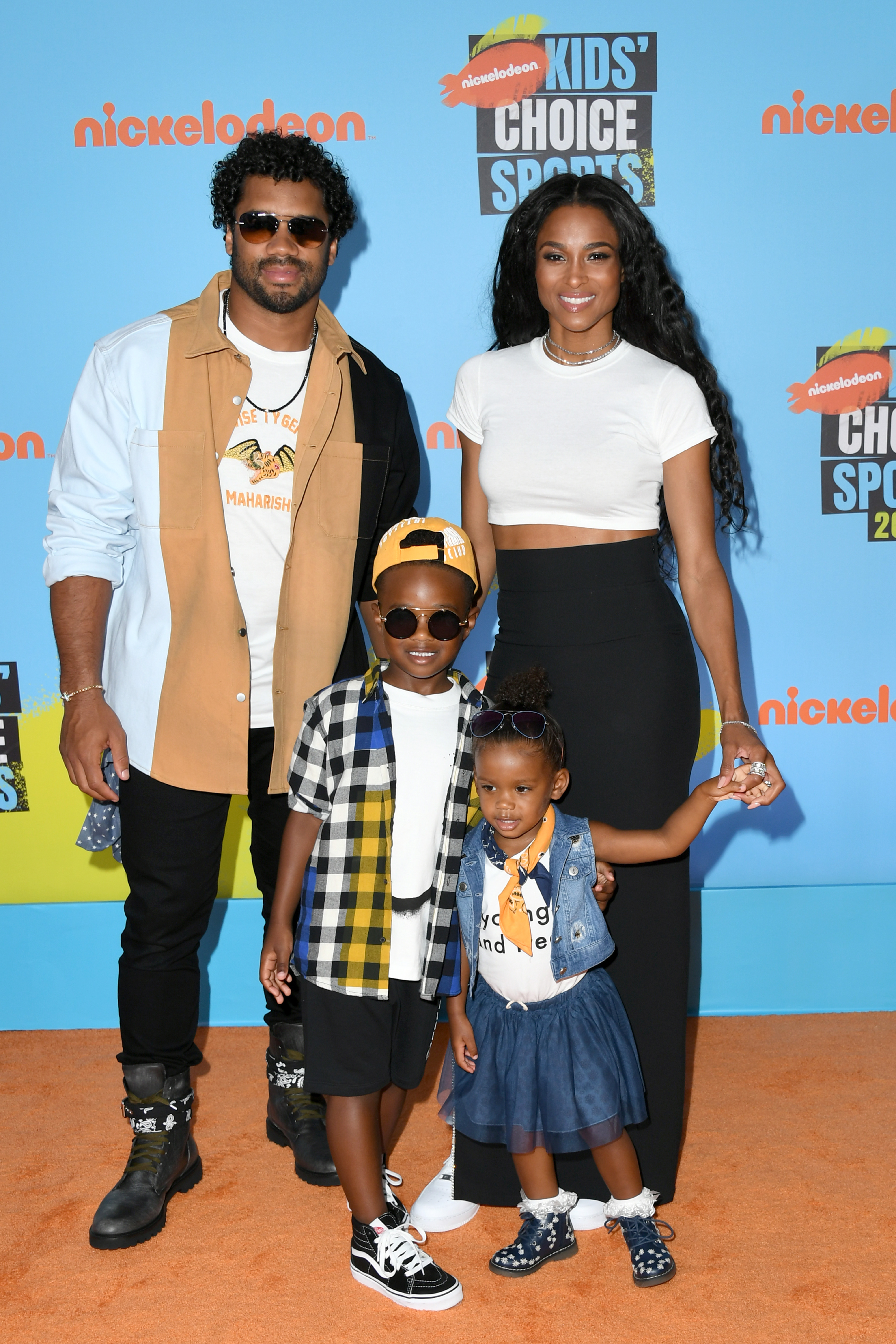 Russell Wilson, 30, Ciara, 33, Future Zahir Wilburn, 5, and Sienna Princess Wilson, 2, attend Nickelodeon Kids' Choice Sports at Barker Hangar on July 11, 2019, in Santa Monica, California.
