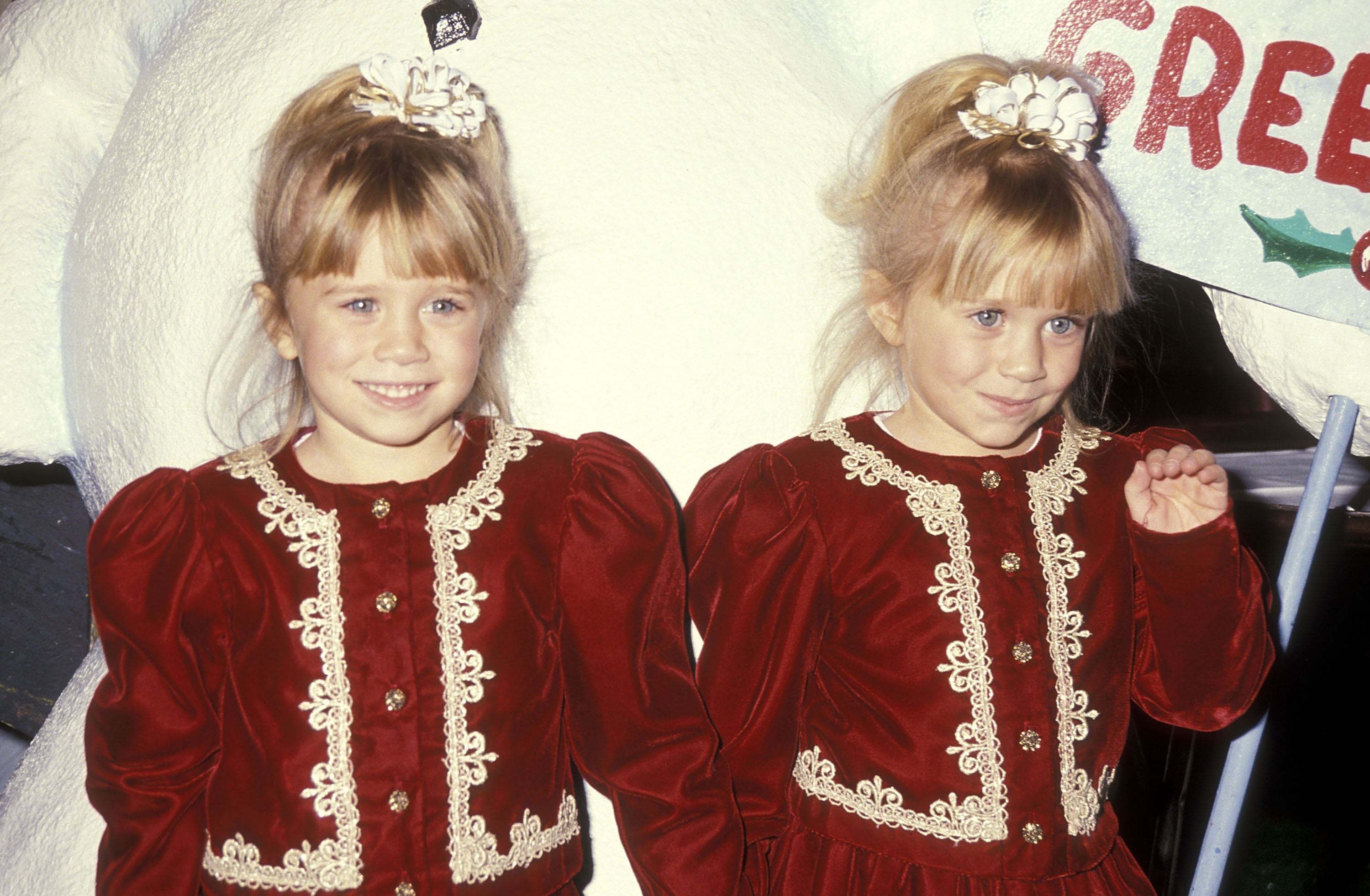 Childhood elongation began replacing the lingering baby fullness in the faces of the sisters, now 5, as they stepped out at the Hollywood Christmas Parade on December 1, 1991, dressed in opulent burgundy velvet gowns with golden lace trim and cream scrunchies securing high ponytails.