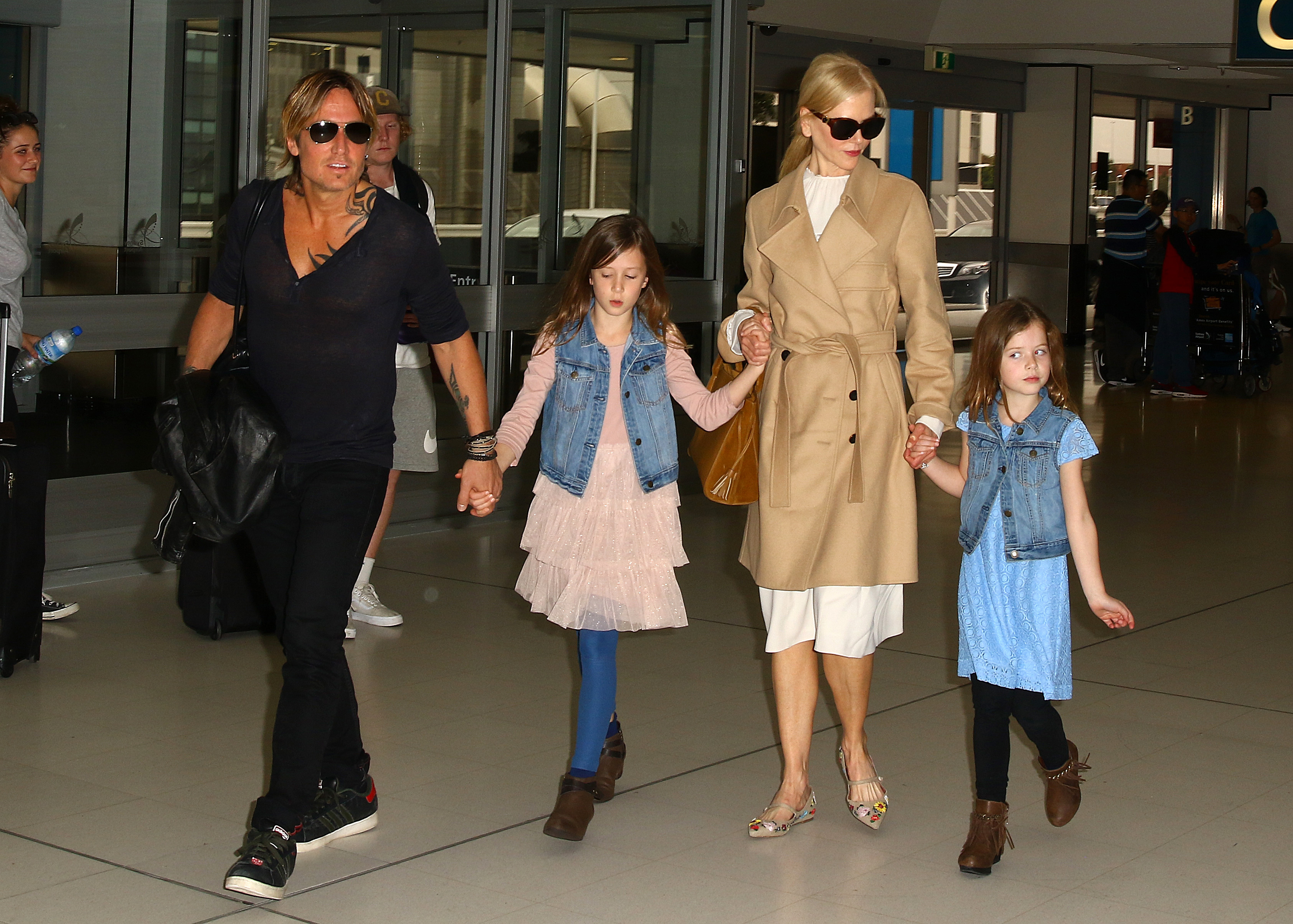 Nicole Kidman and Keith Urban arrive at Sydney Airport with their daughters, Sunday Rose and Faith Margaret, in 2017. The couple, who married in 2006, spent 19 years together and raised two daughters before Kidman filed for divorce from Urban in September 2025. | Source: Getty Images