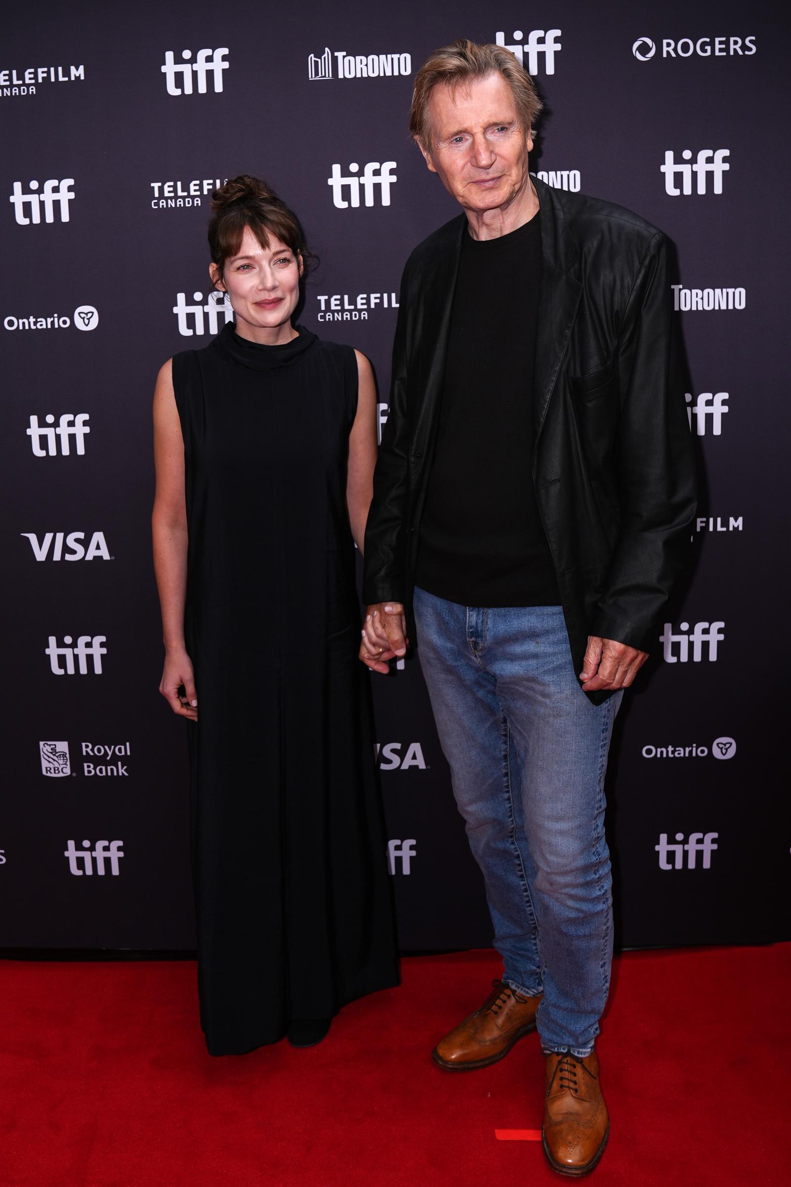 Stella Stocker and Liam Neeson attend the premiere of 'Evil Genius' during the Toronto International Film Festival at Roy Thomson Hall in Toronto, Ontario, Canada on September 12, 2026. | Source: Getty Images