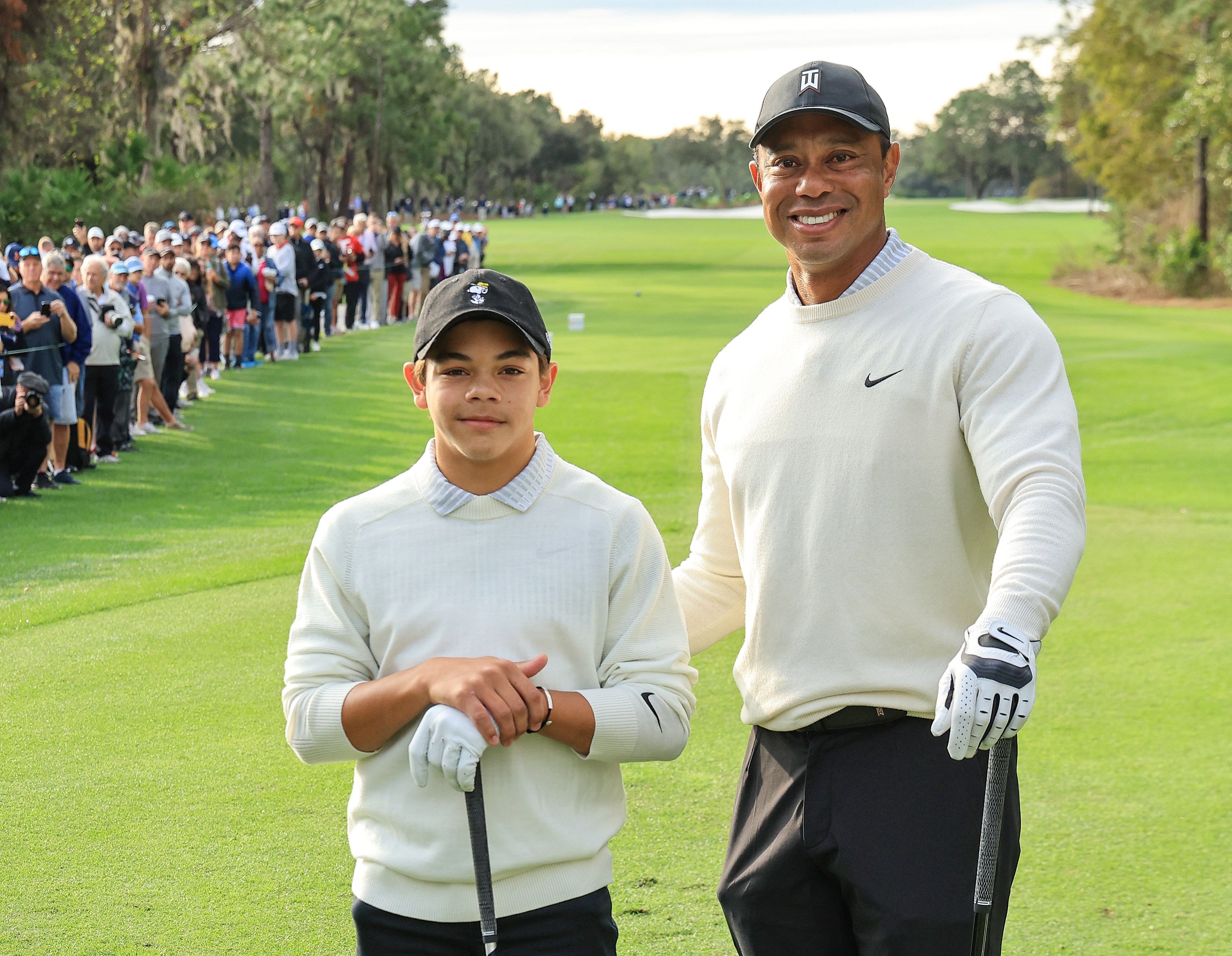 Tiger Woods and Charlie Woods pose on the first tee during the Friday pro-am as a preview for the PNC Championship at The Ritz-Carlton Golf Club on December 16, 2022, in Orlando, Florida | Source: Getty Images