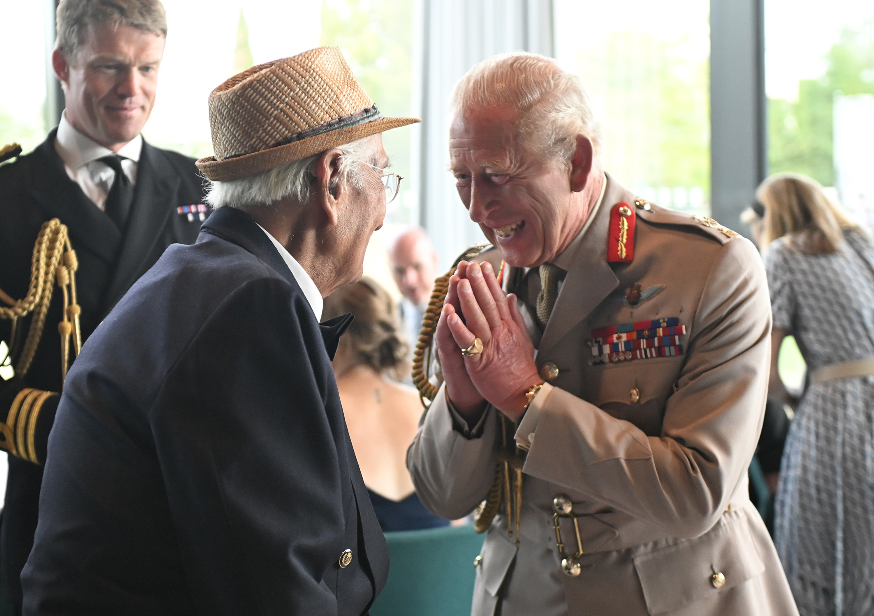 King Charles III talks with Yavar Abbas during a Service of Remembrance to commemorate the 80th Anniversary of VJ Day at The National Memorial Arboretum on August 15, 2025, in Alrewas, Staffordshire | Source: Getty Images