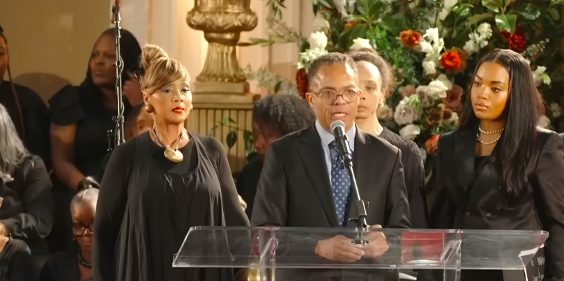 Jesse Jackson Jr. speaking onstage at his father, Jesse Jackson's private memorial service, surrounded by loved ones, posted on March 7, 2026. | Source: YouTube/CBS Chicago