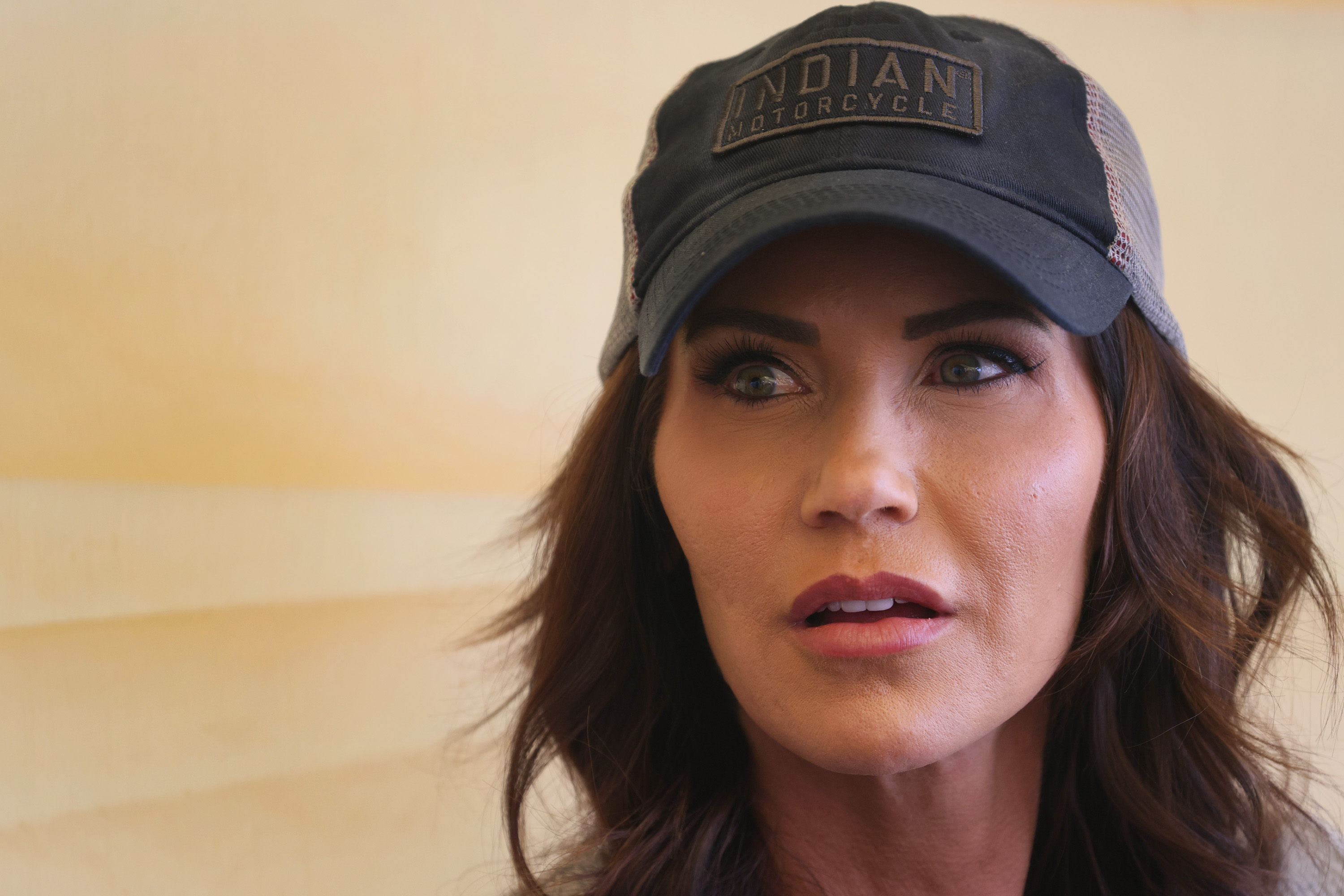 Kristi Noem speaks to reporters at the Sturgis Buffalo Chip campground after riding in the Legends Ride for charity on August 9, 2021, near Sturgis, South Dakota | Source: Getty Images