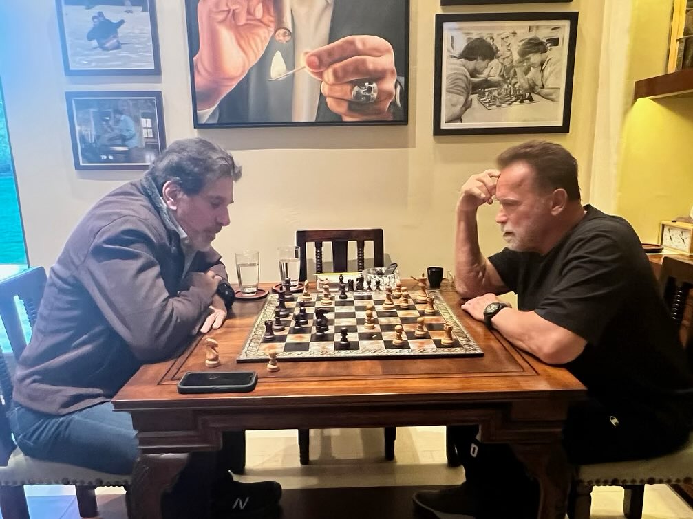 Arnold Schwarzenegger locks in during a chess match at home in a photo posted on January 12, 2024 | Source: Facebook/arnold