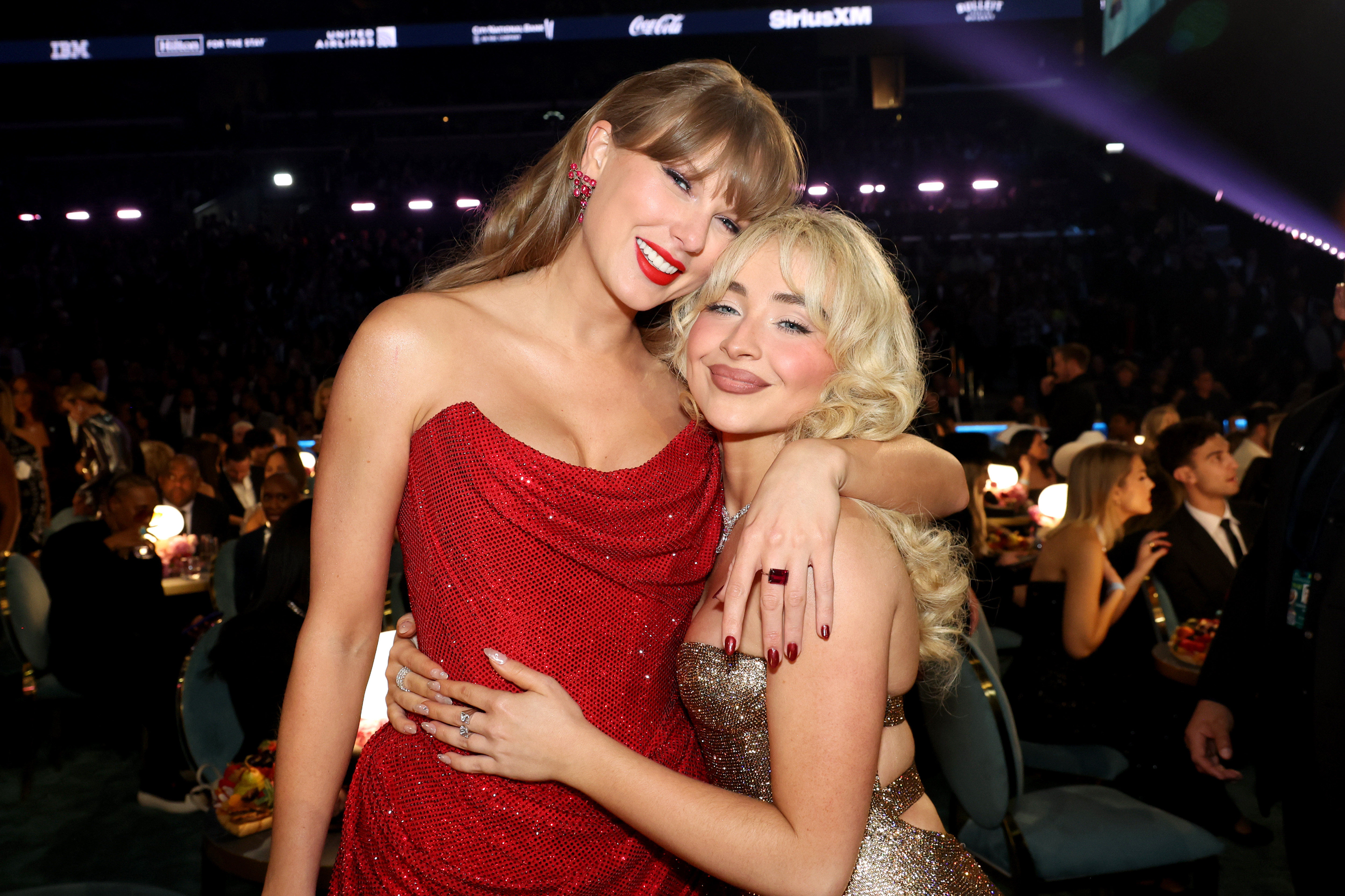 Taylor Swift and Sabrina Carpenter pose together at an event in 2025. | Source: Getty Images