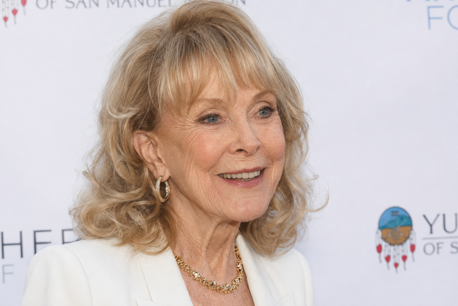 An artificial intelligence visualization portrays Barbara Eden with more pronounced facial lines and reduced facial fullness while preserving her recognizable smile and signature blonde curls. | Source: ChatGPT