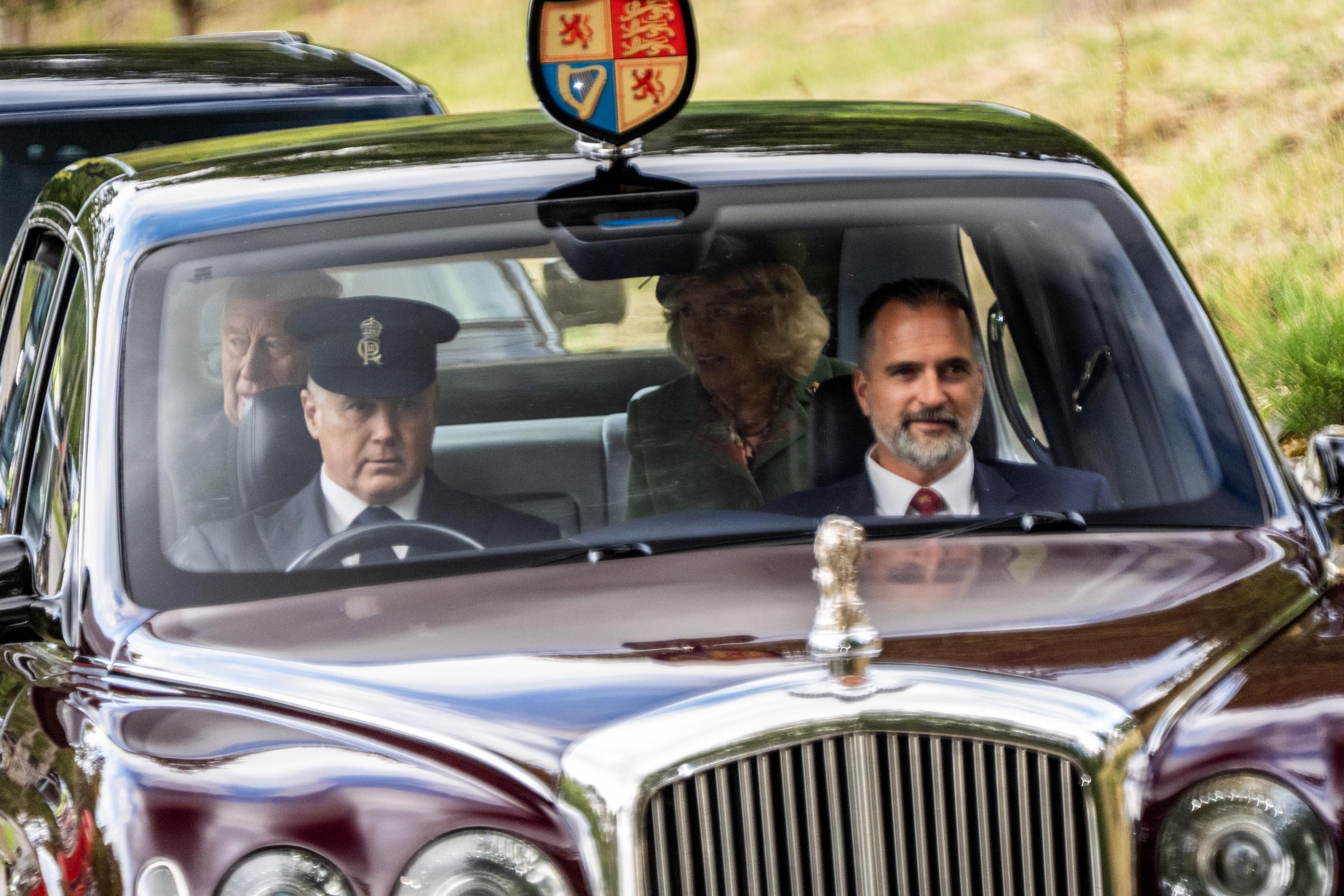 King Charles III and Queen Camilla arrive by car to attend a Sunday church service at Crathie Kirk, near Balmoral on August 23, 2026. | Source: Getty Images