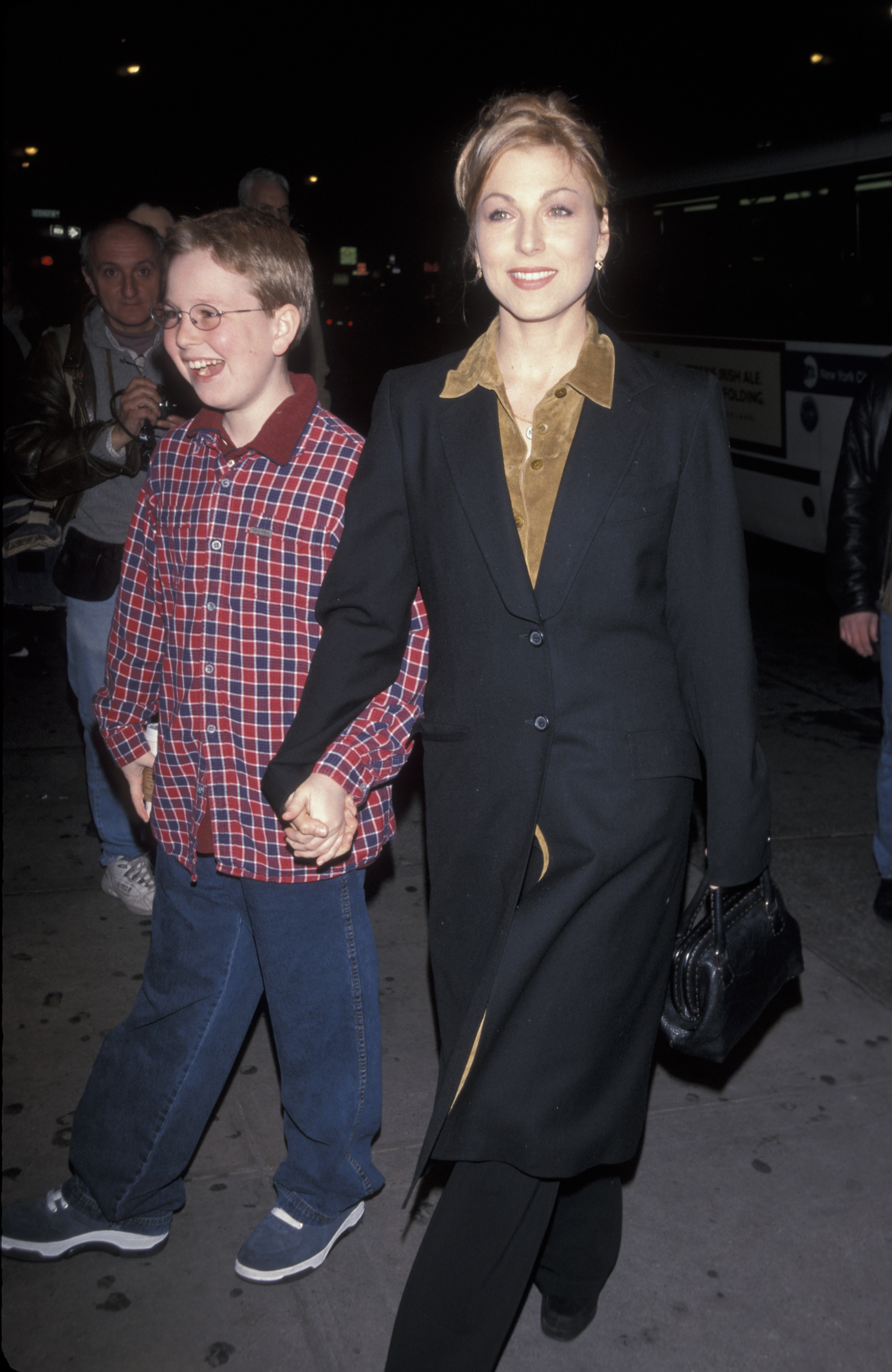 Tatum and her eldest son, Kevin McEnroe, were photographed together during a New York outing in the 1990s. Kevin later revealed that he had stopped asking his mother to seek sobriety when he was just 12, after years of hoping she would overcome her addiction. | Source: Getty Images.