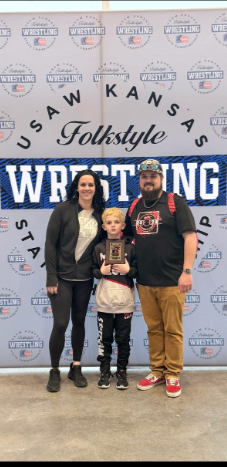 Nicholas Schafer poses with his wife, Ashley, and their son, Bentley, in a family photo. Nicholas, 35, died in the October 17 tragedy at Stryker Sports Complex, while a fundraiser organized by Mac Wrestling Club highlighted the family's loss and the support they need in the aftermath. | Source: Gofundme