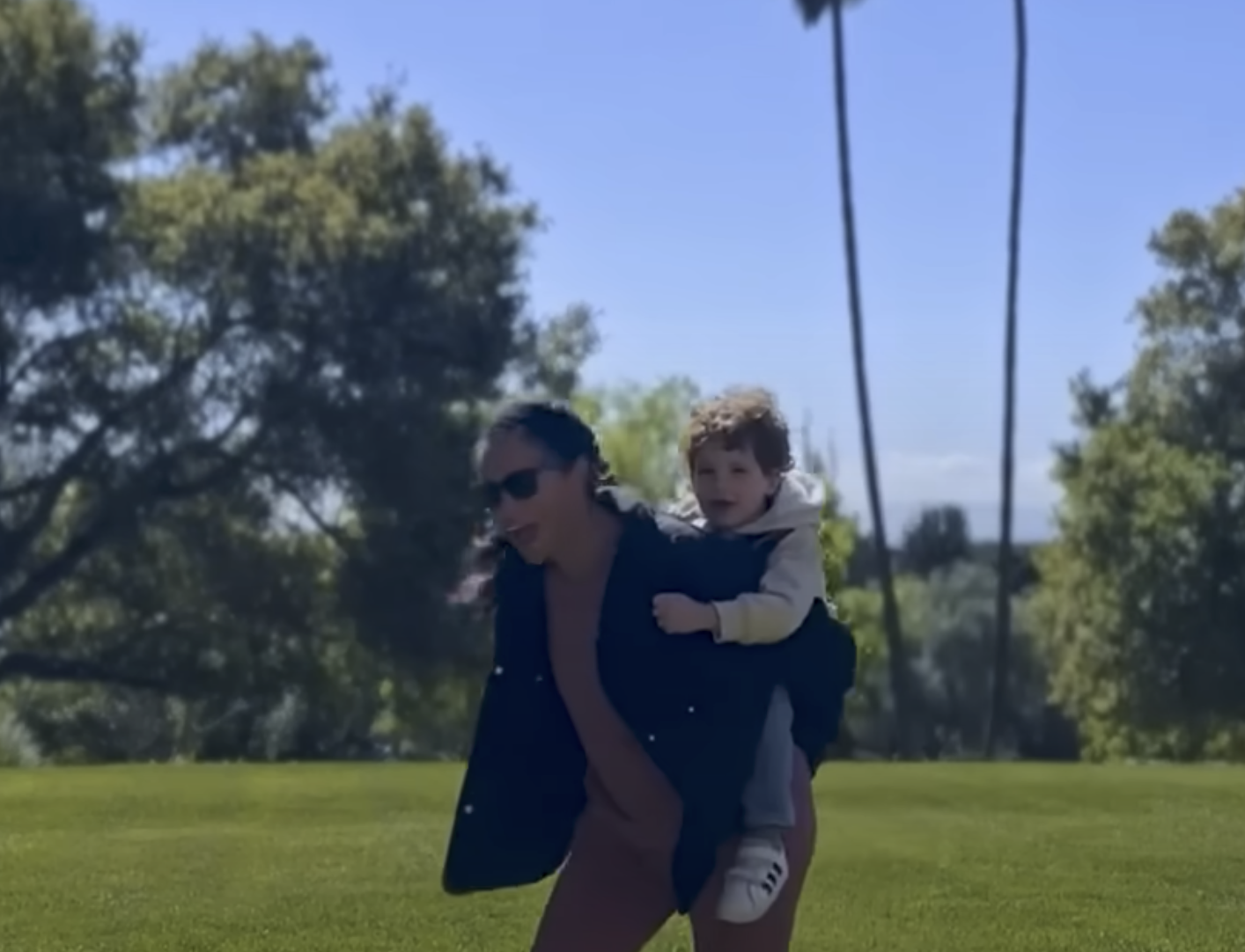 Meghan Markle piggybacking Prince Archie | Source: YouTube/LMT