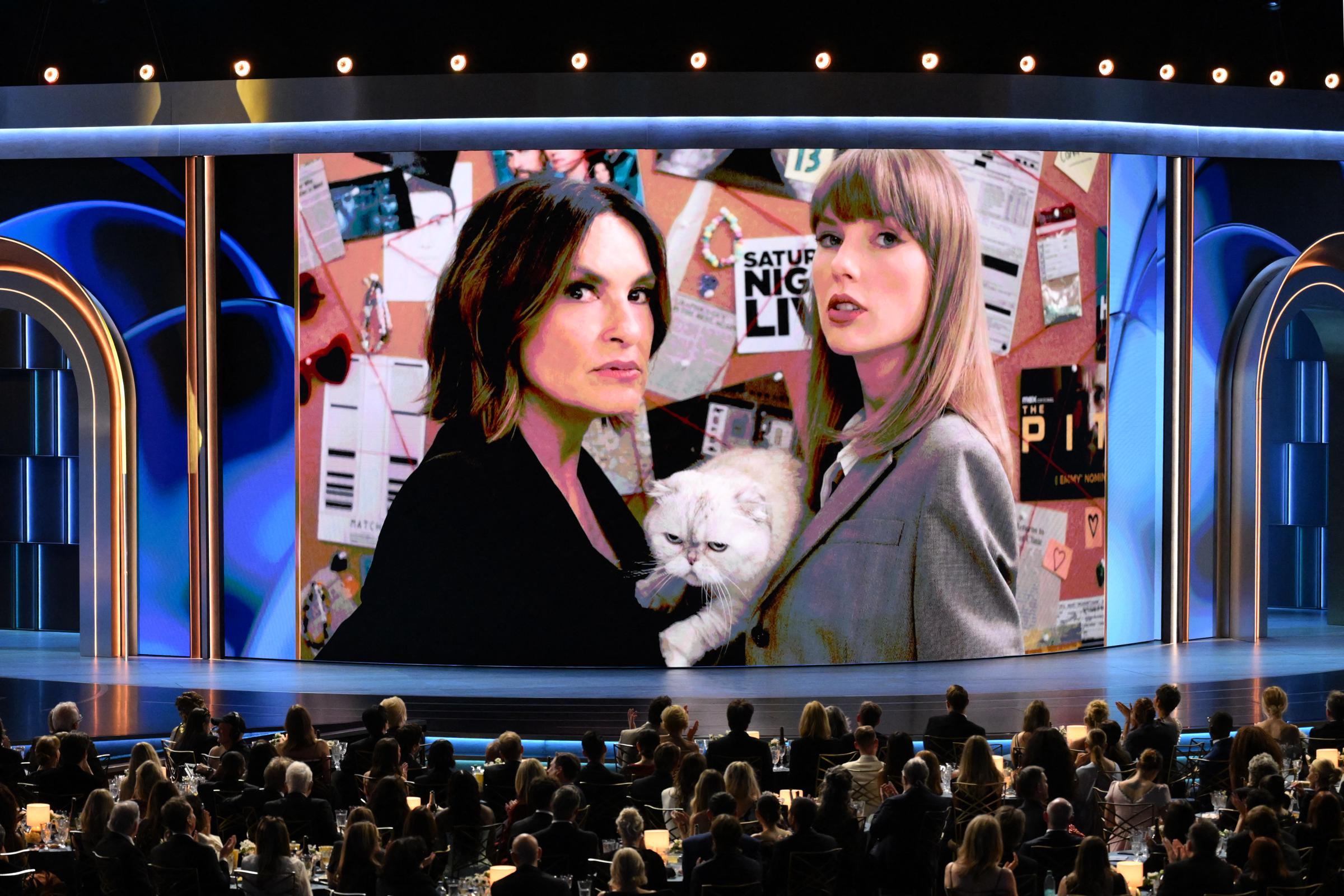 Mariska Hargitay, Taylor Swift, and Swift's cat, Olivia Benson, appear on screen during a pre-taped sketch for the 78th Primetime Emmy Awards at the Peacock Theater in Los Angeles on September 14, 2026. | Source: Getty Images