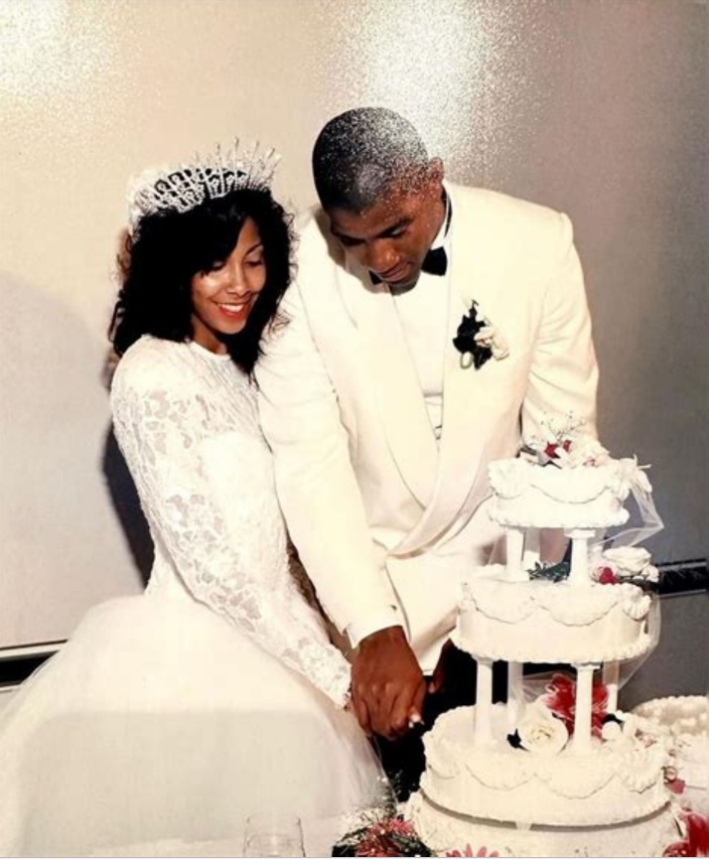 Magic Johnson and Cookie Johnson cutting their wedding cake during their elegant 1991 ceremony. | Source: Facebook/Retrospect 90s 00s