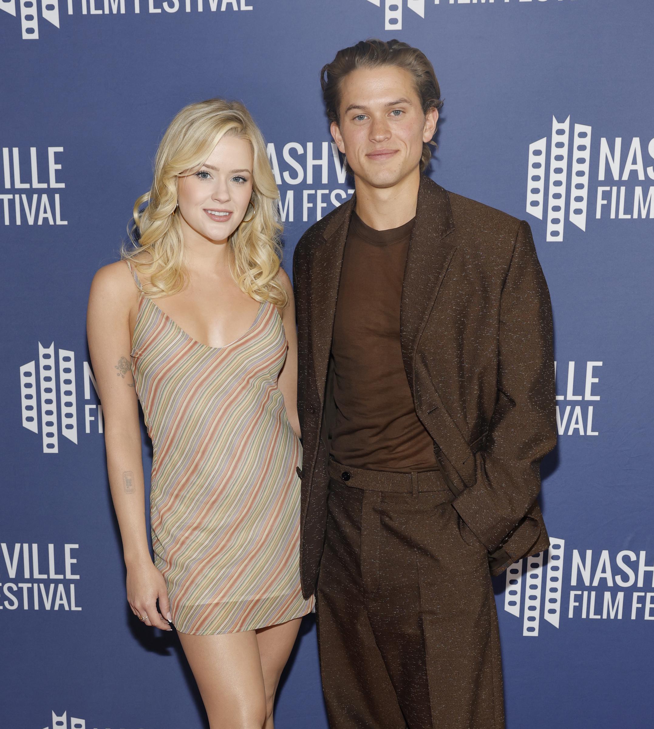 Deacon and Ava made it a sibling moment as they posed together at the Nashville Film Festival. His tonal brown suit contrasted with her colorful striped mini dress, giving each sibling a distinct look on the carpet.