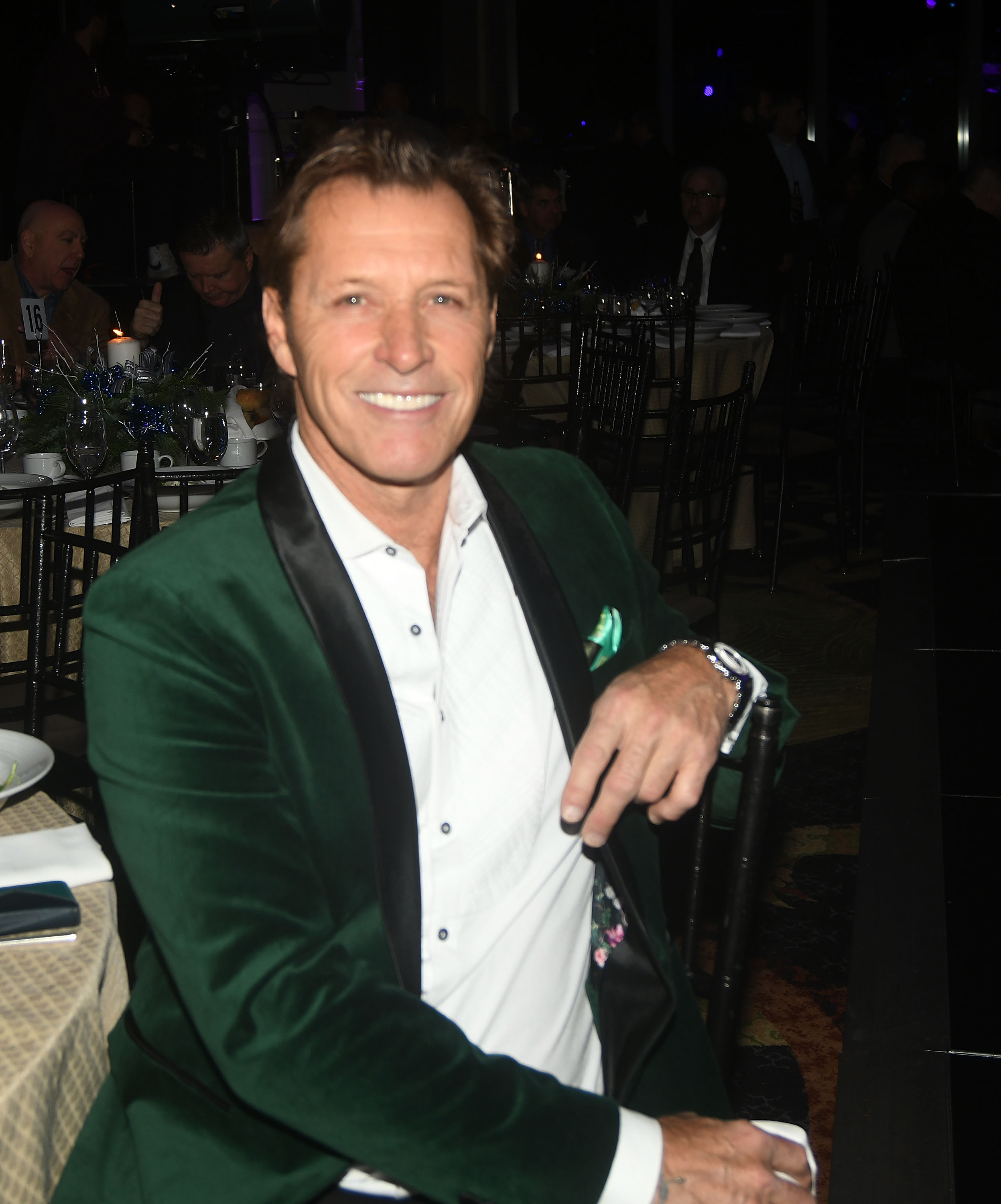 Duguay smiles in a dark green velvet jacket at Little Steven's Policeman's Ball in New York City on December 20, 2022. Earlier that year, Sarah Palin had spoken publicly about the trust and comfort she found in their relationship, a bond she later mourned following his death. | Source: Getty Images