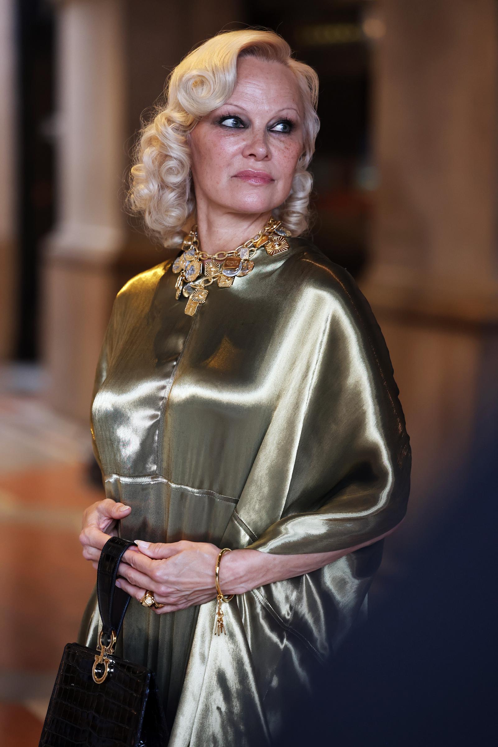 Pamela Anderson is pictured at Vogue World: Milano 2026 at Galleria Vittorio Emanuele II on September 22, 2026. Her appearance came three years after she drew attention for going makeup-free at Paris Fashion Week. | Source: Getty Images