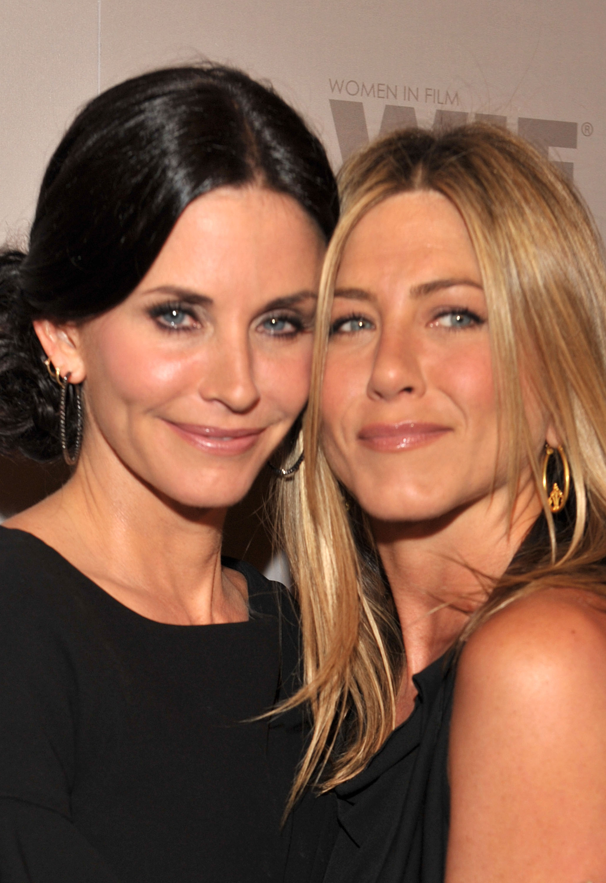 Posing side by side with their cheeks touching, Courteney Cox and Jennifer Aniston once again show a striking resemblance. From their cheekbones to their eyes and lips, their features align as they smile. The two were photographed on arrival at the Crystal + Lucy Awards: A New Era at the Hyatt Regency Century Plaza in Century City, California.