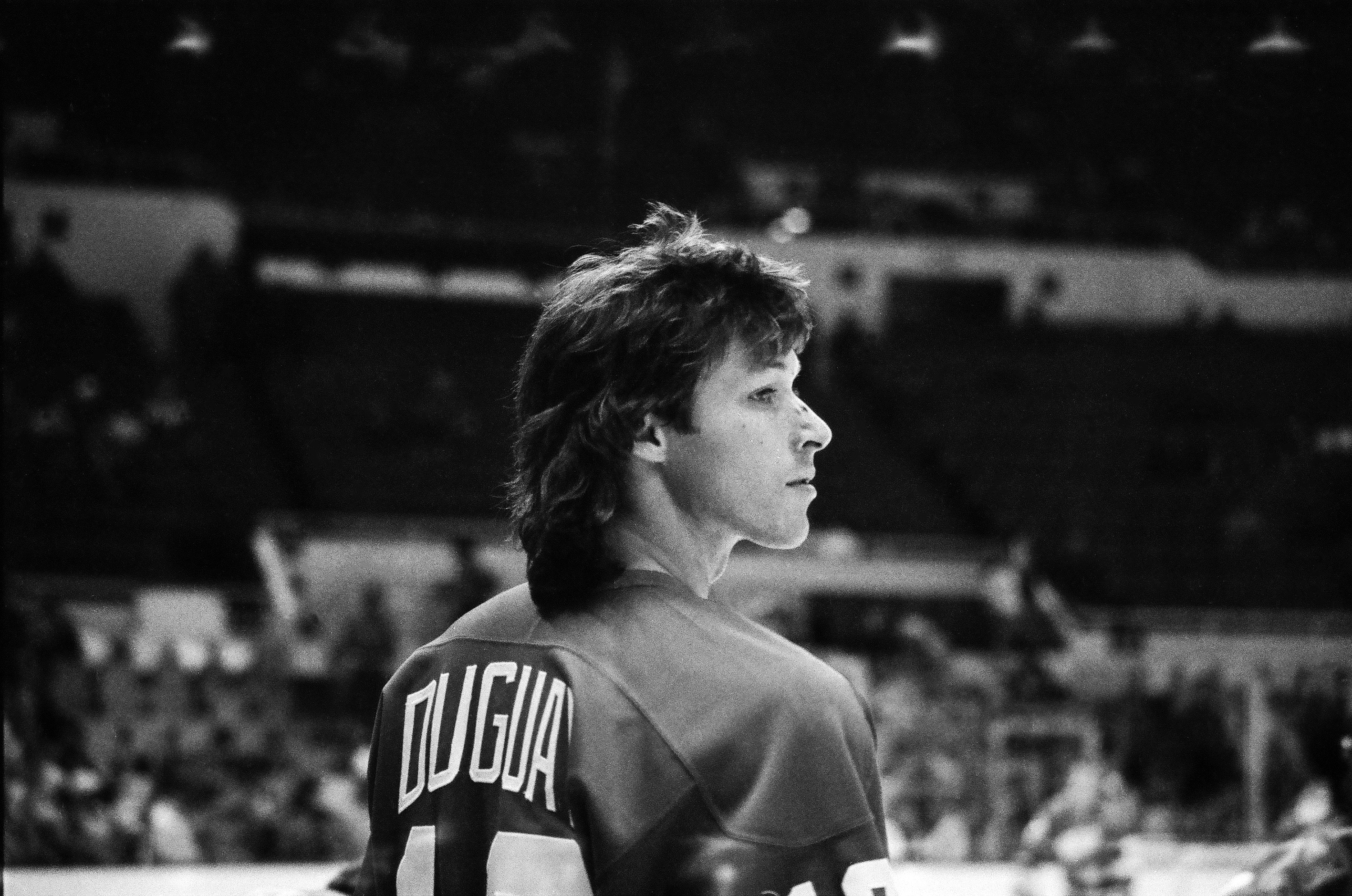 Ron Duguay looks across the ice during a Detroit Red Wings game against the New York Islanders on January 22, 1985, in Uniondale, New York. The black-and-white photograph captures the former Rangers star during one of his strongest NHL seasons, when he recorded a career-high 89 points with Detroit. | Source: Getty Images