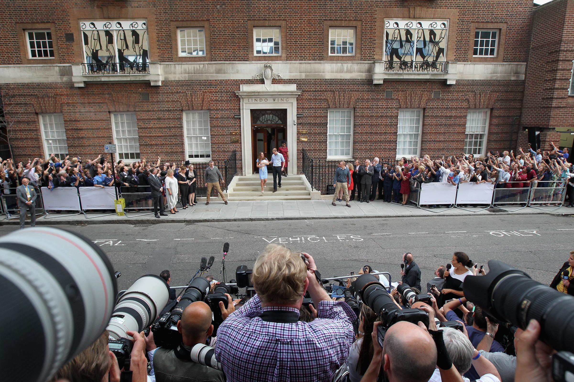 Prince William and Princess Catherine introduce newborn Prince George to the world outside St. Mary's Hospital in London on July 23, 2013. Crowds and photographers gathered to catch their first glimpse of the future king. | Source: Getty Images
