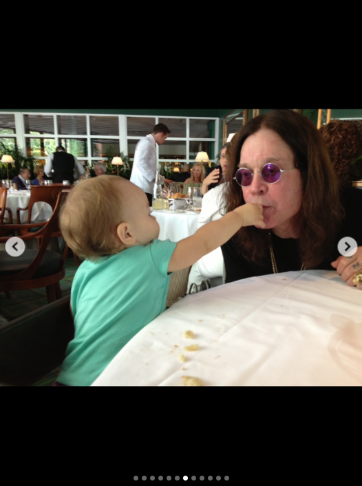 Ozzy Osbourne plays with his grandchild, from a post dated July 24, 2025 | Source: Instagram/lisastelly