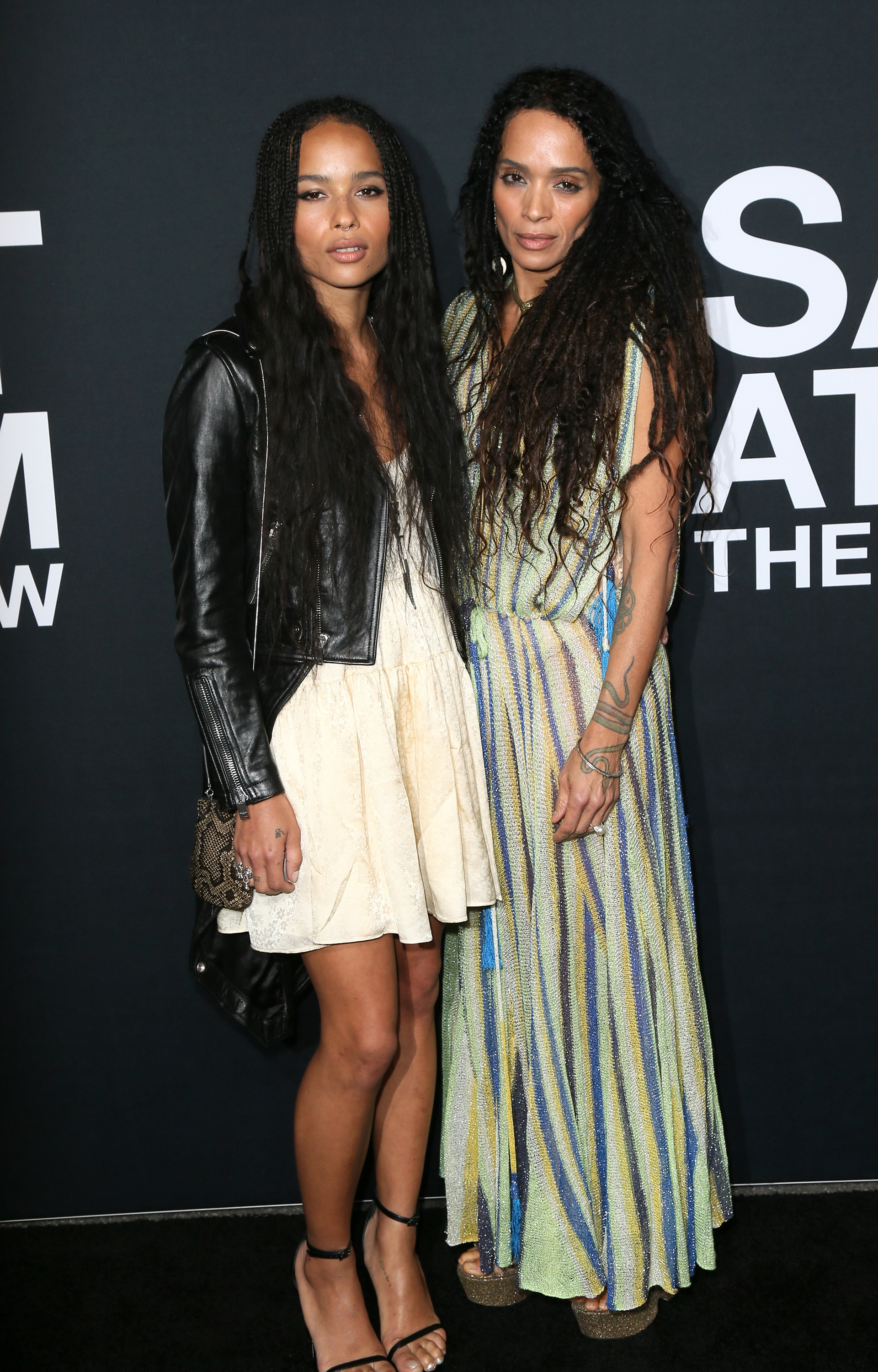 Zoë Kravitz and Lisa Bonet pose together at a Saint Laurent event in Los Angeles, showcasing their striking resemblance and effortlessly coordinated style on the red carpet.