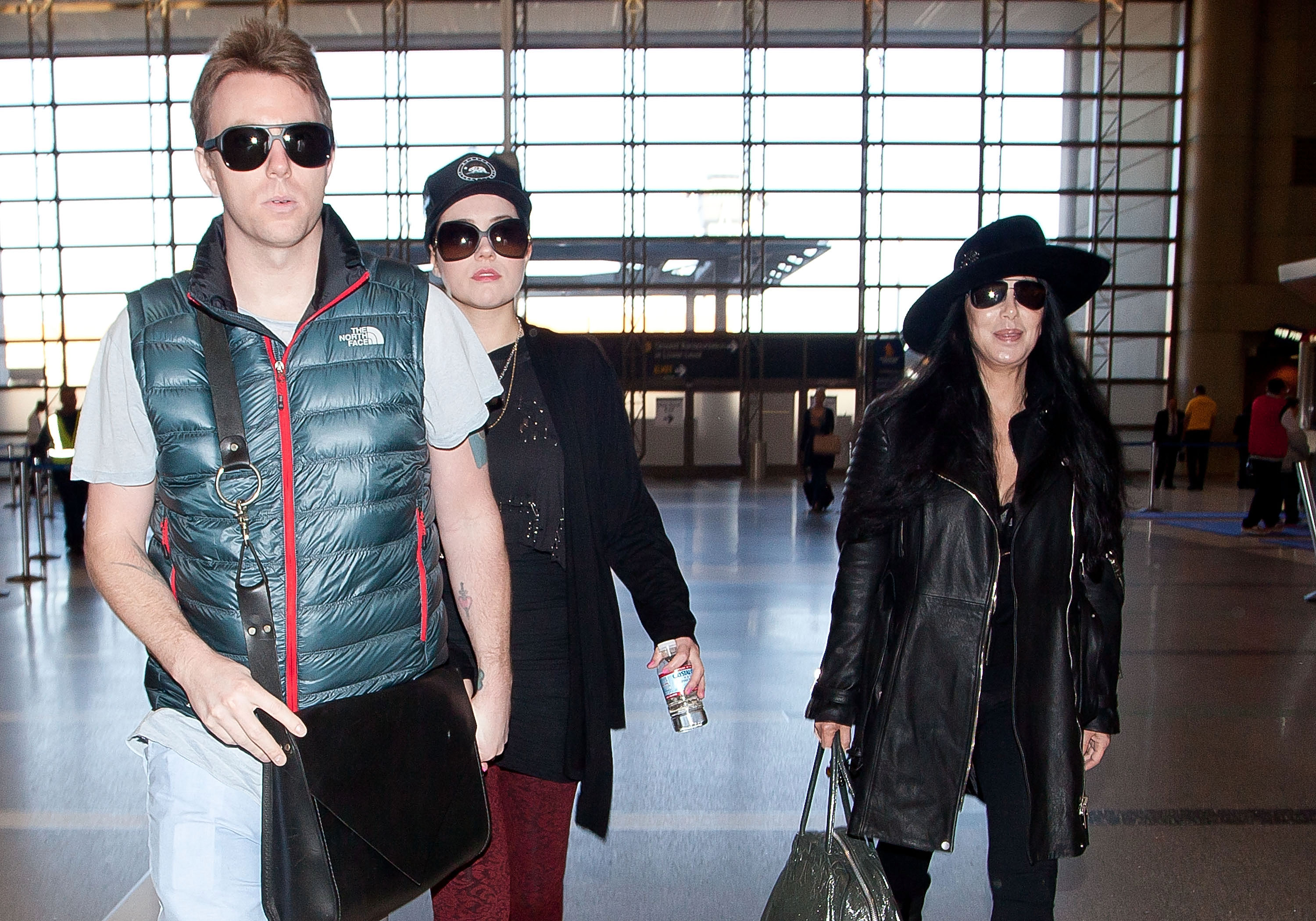 Elijah Blue Allman is pictured with an unnamed woman and Cher on December 10, 2012, in Los Angeles, California | Source: Getty Images