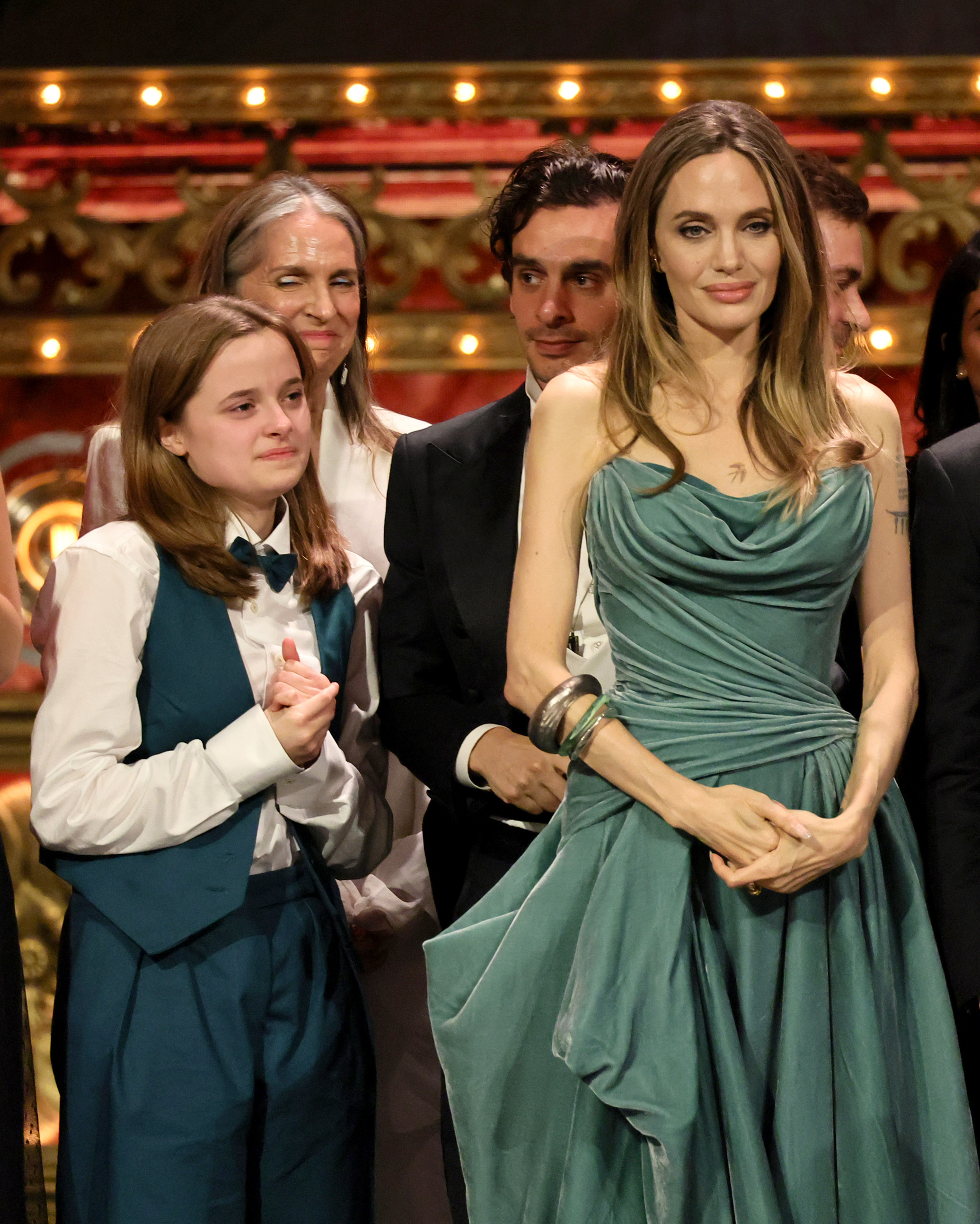 Vivienne Jolie, her mother, Angelina Jolie, and other cast and crew accept the Best Musical award for "The Outsiders" onstage during The 77th Annual Tony Awards at David H. Koch Theater at Lincoln Center in New York City on June 16, 2024 | Source: Getty Images