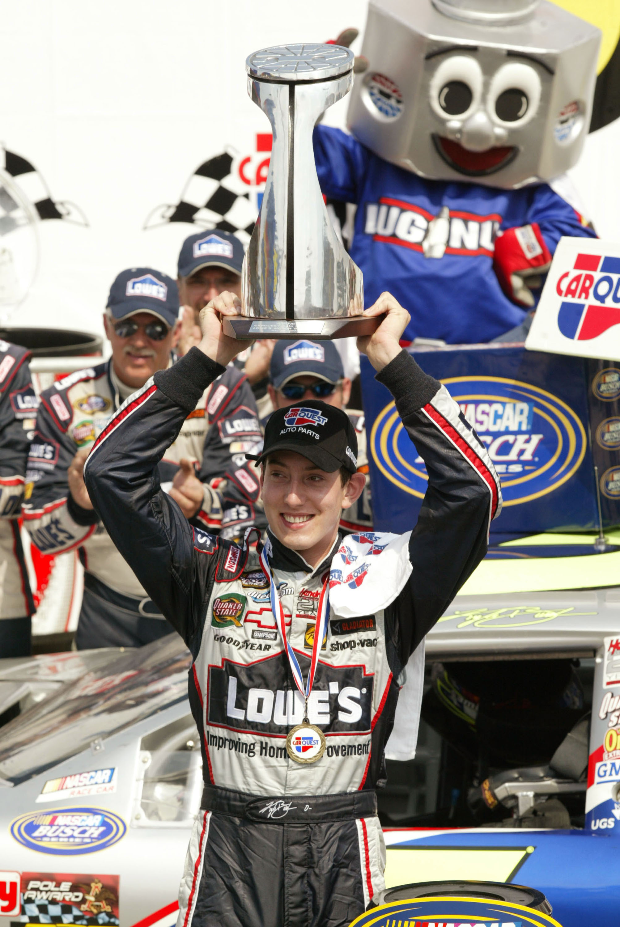 Kyle Busch and his No.5 Lowes Chevrolet Monte Carlo crew celebrating their victory at Carquest Auto Parts 300 in Concord, North Carolina on May 29, 2004. | Source: Getty Images