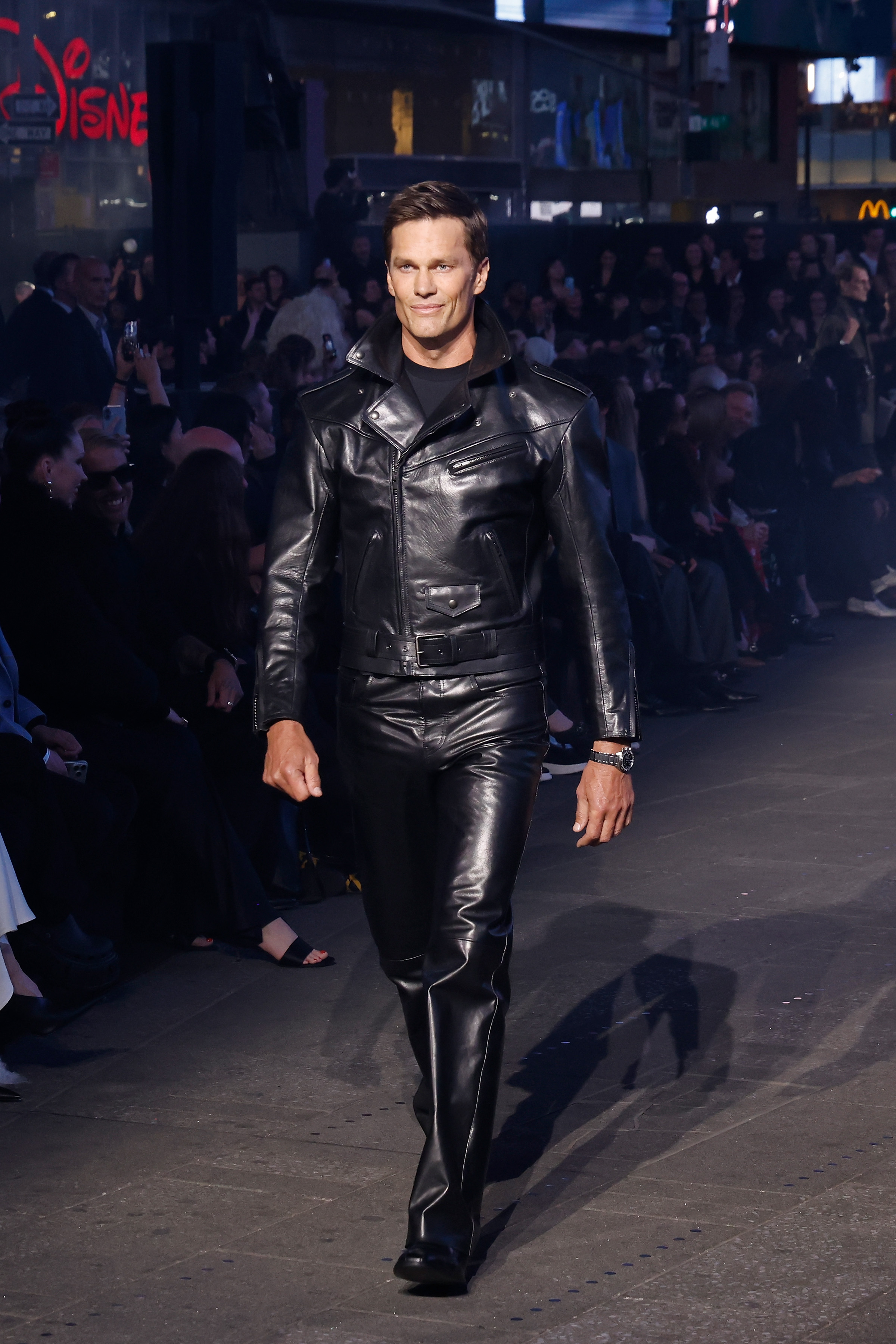 Tom Brady walked the Gucci Cruise 2027 runway in Times Square wearing an all-black leather outfit that sparked widespread reactions online.