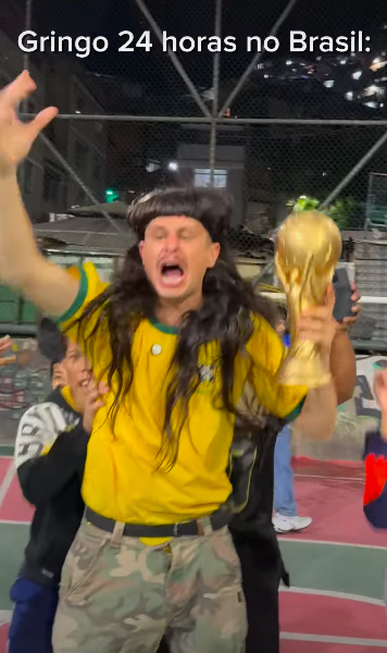The clip ended with Tree celebrating with a makeshift trophy and red roses, a finale that fans are now watching differently. The caption, "Americano pela 1º vez no Brasil," roughly translated to "An American in Brazil for the first time." | Source: Instagram/iae.break and olivertree