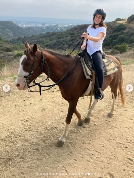 Christina Downer riding a horse, from a post dated April 29, 2026 | Source: Instagram/jimmyfowlie