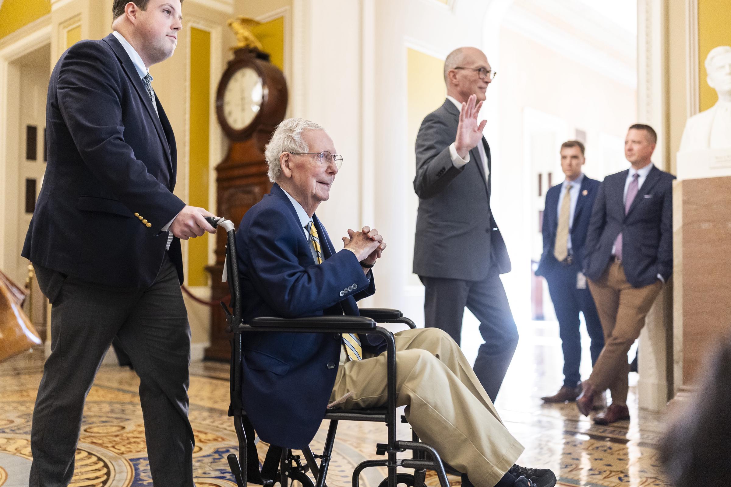 McConnell is pictured in profile as he moves through the U.S. Capitol on September 14, 2026. With his hands clasped, he looks toward people gathered along the hallway. | Source: Getty Images