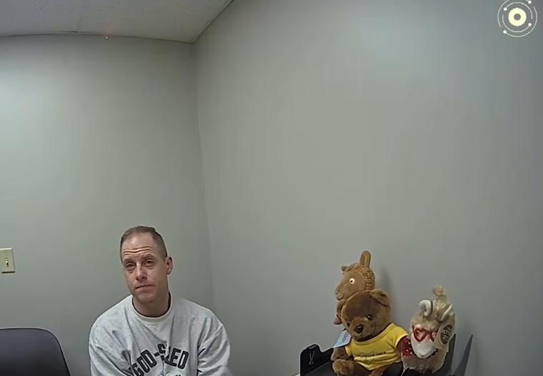 Bodycam footage showing Caleb Flynn listening to an officer regarding DNA collection, dated March 2, 2026 | Source: YouTube/Law&Crime Network
