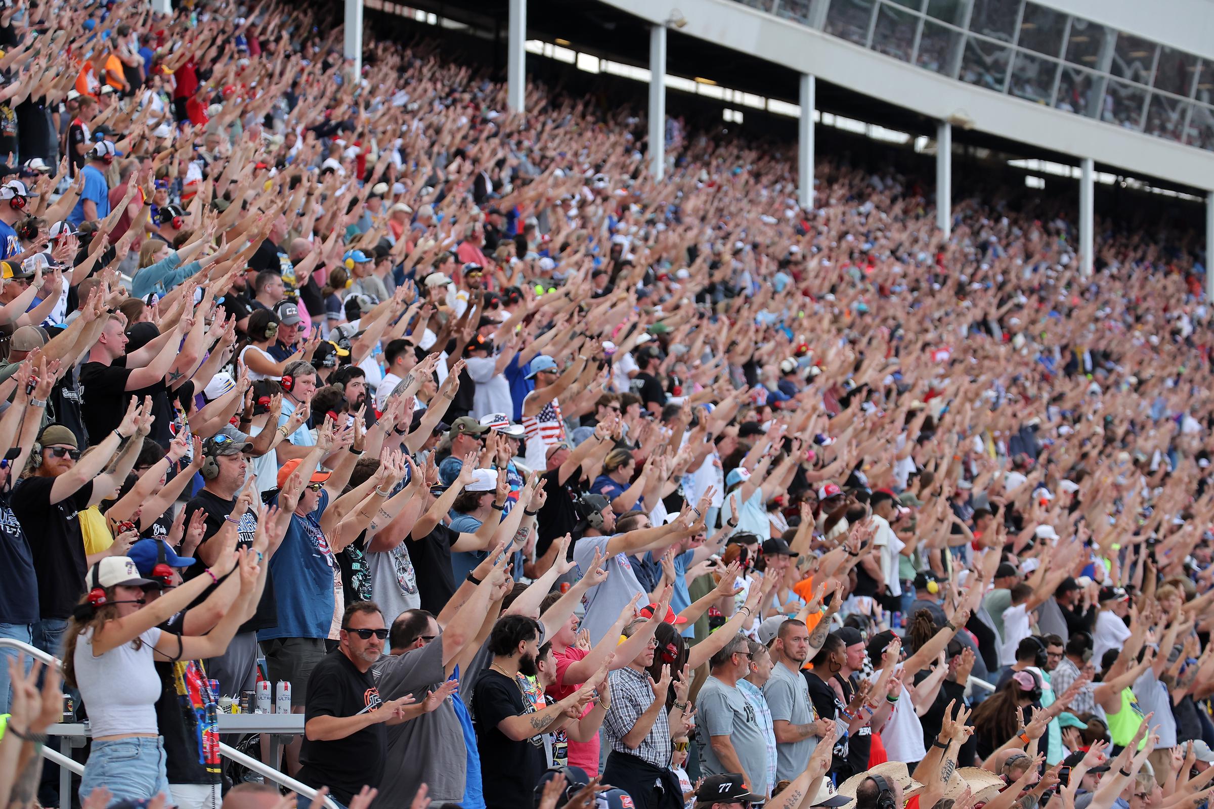 NASCAR fans in the grandstands gesturing the number eight in honor of Kyle Busch at Charlotte Motor Speedway on May 24, 2026 | Source: Getty Images